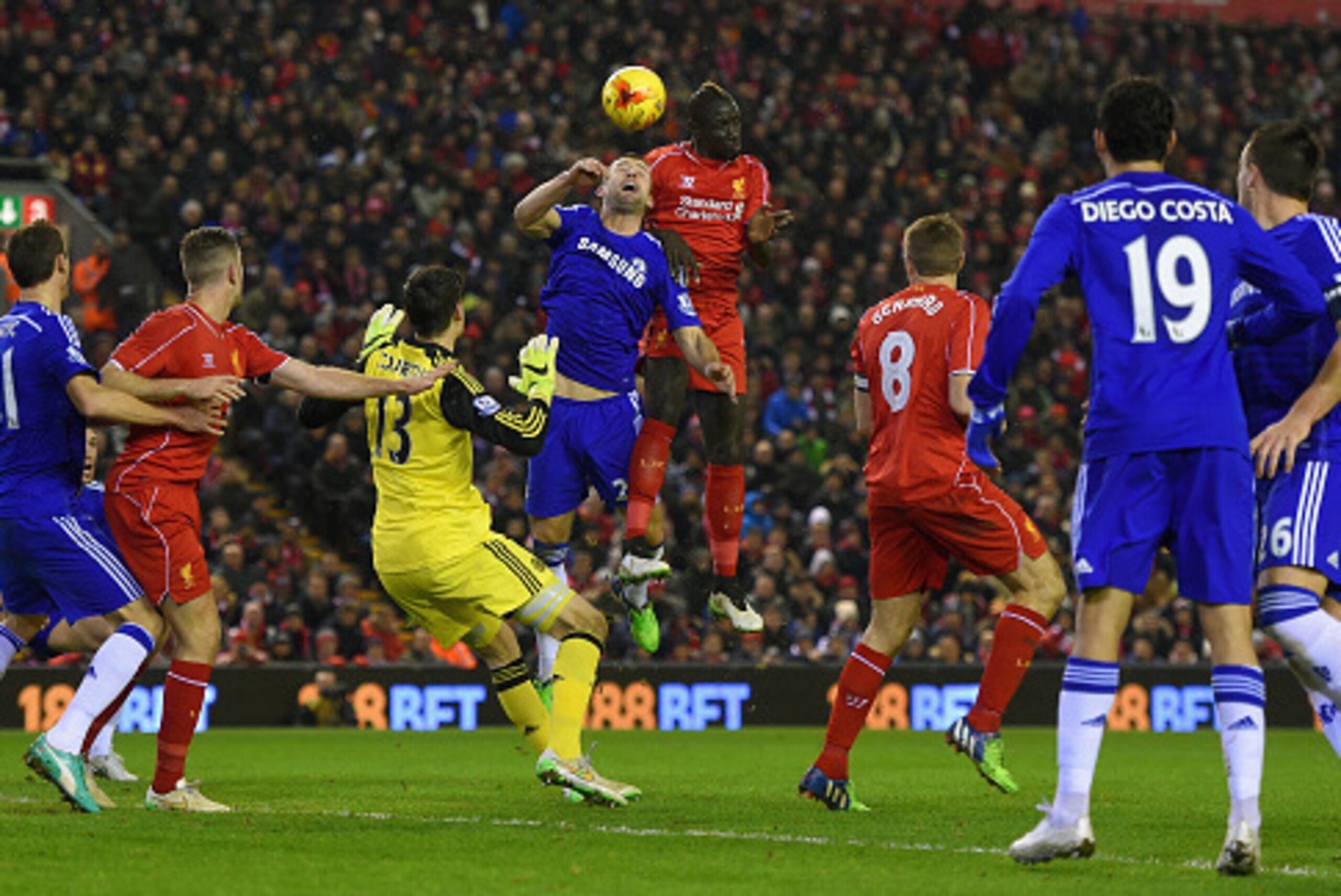 LIVERPOOL, ENGLAND - JANUARY 20: Gary Cahill of Chelsea gies up for the ball with Mamadou Sakho of Liverpool during the Capital One Cup Semi-Final first leg match between Liverpool and Chelsea at Anfield on January 20, 2015 in Liverpool, England.  (Photo 