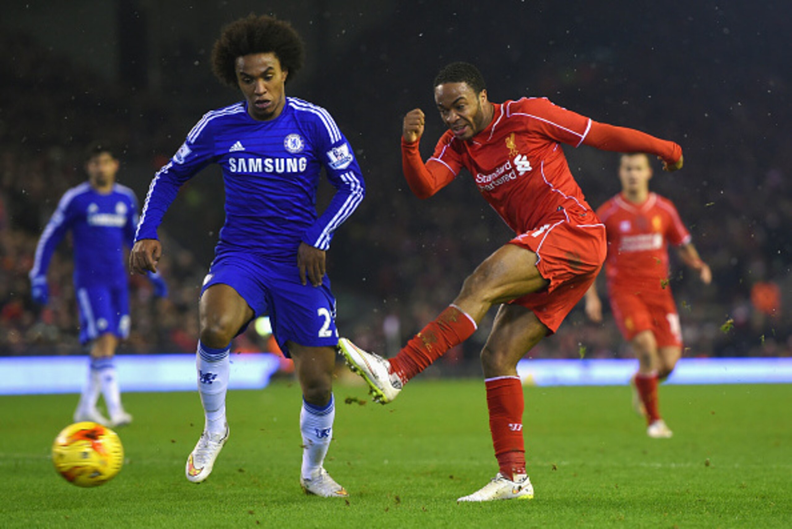 LIVERPOOL, ENGLAND - JANUARY 20:  Willian of Chelsea closes down Raheem Sterling of Liverpool during the Capital One Cup Semi-Final first leg match between Liverpool and Chelsea at Anfield on January 20, 2015 in Liverpool, England.  (Photo by Michael Rega