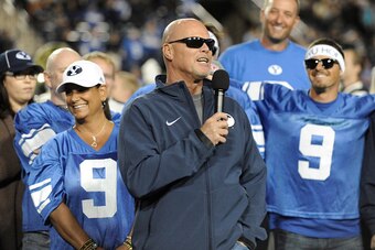 PROVO, UT - OCTOBER 03: Jim McMahon, former Brigham Young Cougars quarterback, on field at halftime during the game against Utah State Aggies at LaVell Edwards Stadium on October 3, 2014 in Provo, Utah. McMahon was inducted into the school's Hall of Fame 
