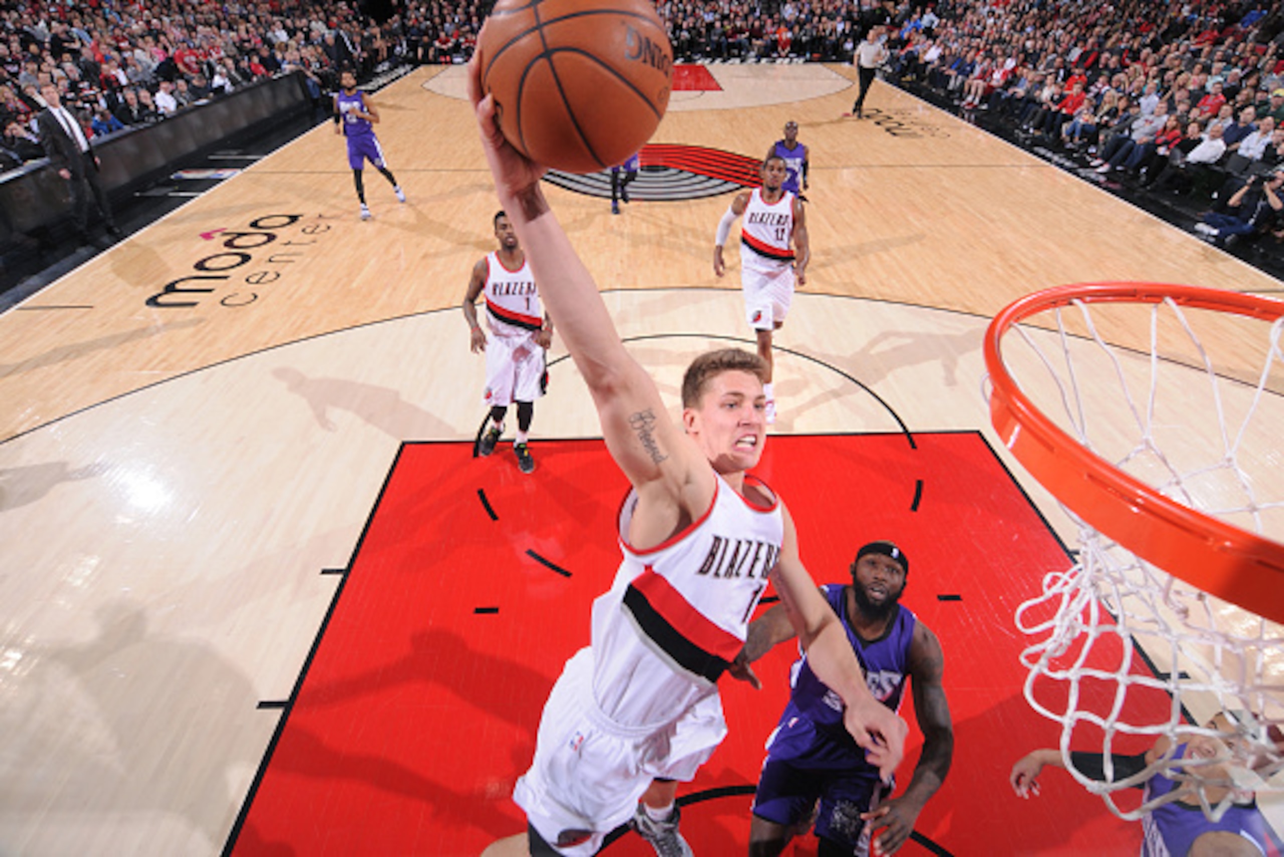 PORTLAND, OR -  JANUARY 19: Meyers Leonard #11 of the Portland Trail Blazers goes for the dunk against the Sacramento Kings during the game on January 19, 2015 at Moda Center in Portland, Oregon . NOTE TO USER: User expressly acknowledges and agrees that,