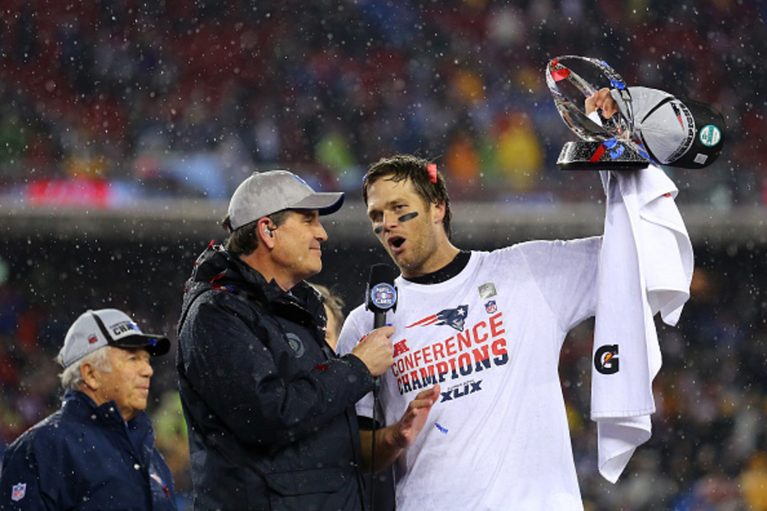 FOXBORO, MA - JANUARY 18:  Tom Brady #12 of the New England Patriots holds up the Lamar Hunt Trophy after defeating the Indianapolis Colts in the 2015 AFC Championship Game at Gillette Stadium on January 18, 2015 in Foxboro, Massachusetts.  The Patriots d