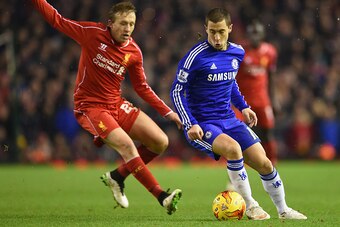 LIVERPOOL, ENGLAND - JANUARY 20: Eden Hazard of Chelsea is marshalled by Lucas Leiva of Liverpool  during the Capital One Cup Semi-Final first leg match between Liverpool and Chelsea at Anfield on January 20, 2015 in Liverpool, England.  (Photo by Michael