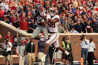OXFORD, MS - OCTOBER 4: Senquez Golson #21 of the Ole Miss Rebels intercepts a pass attempt in the endzone against O.J. Howard #88 of the Alabama Crimson Tide on OCTOBER 4, 2014 at Vaught-Hemingway Stadium in Oxford, Mississippi. Mississippi beat Alabama 