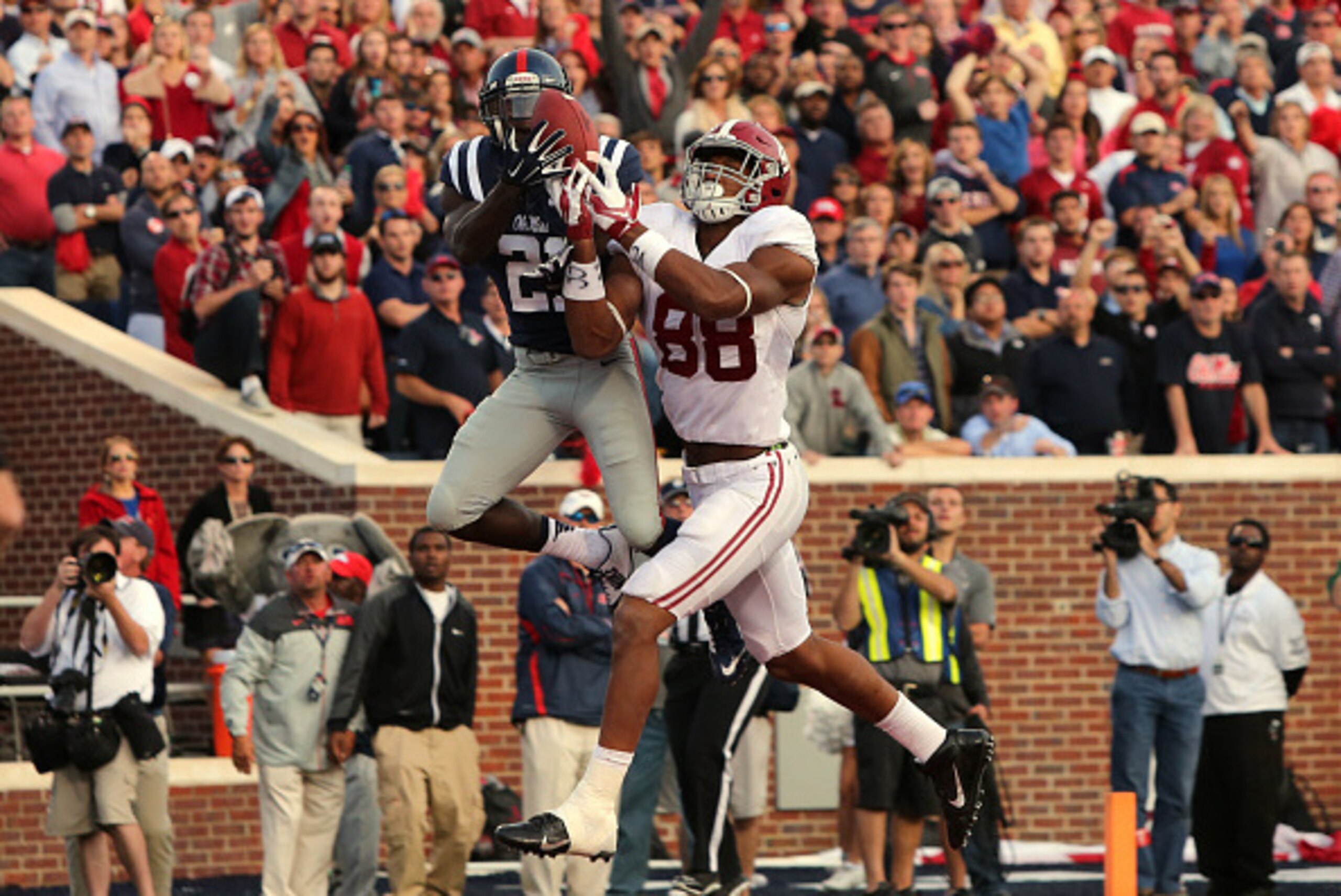 OXFORD, MS - OCTOBER 4: Senquez Golson #21 of the Ole Miss Rebels intercepts a pass attempt in the endzone against O.J. Howard #88 of the Alabama Crimson Tide on OCTOBER 4, 2014 at Vaught-Hemingway Stadium in Oxford, Mississippi. Mississippi beat Alabama 