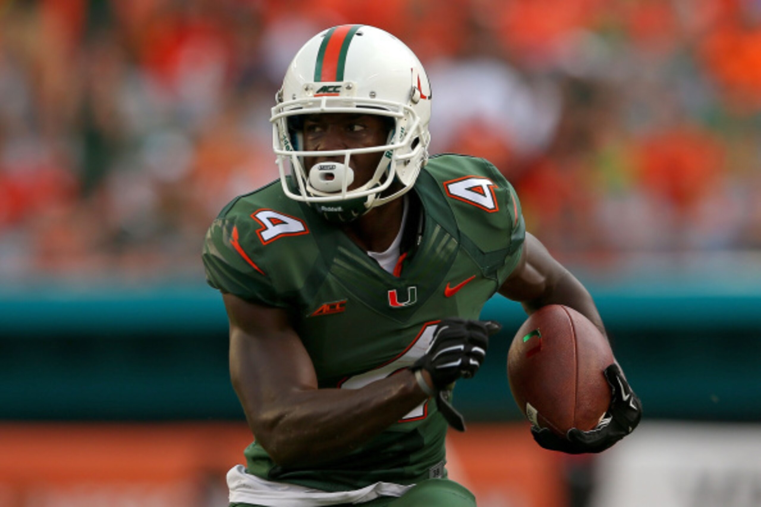 MIAMI, FL - SEPTEMBER 13: Phillip Dorsett #4 of the Miami Hurricanes rushes during a game against the Arkansas State Red Wolves at Sunlife Stadium on September 13, 2014 in Miami, Florida.  (Photo by Mike Ehrmann/Getty Images)