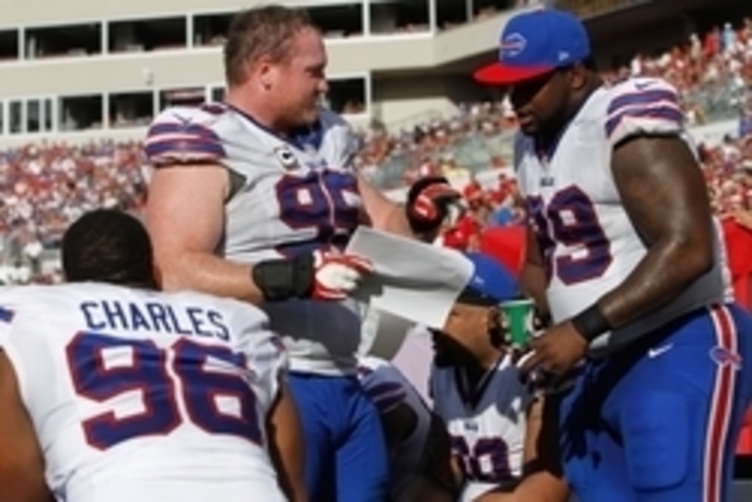 Dec 8, 2013; Tampa, FL, USA; Buffalo Bills defensive tackle Kyle Williams (95) and defensive tackle Marcell Dareus (99) talk on the bench against the Tampa Bay Buccaneers during the second half at Raymond James Stadium. Tampa Bay Buccaneers defeated the B