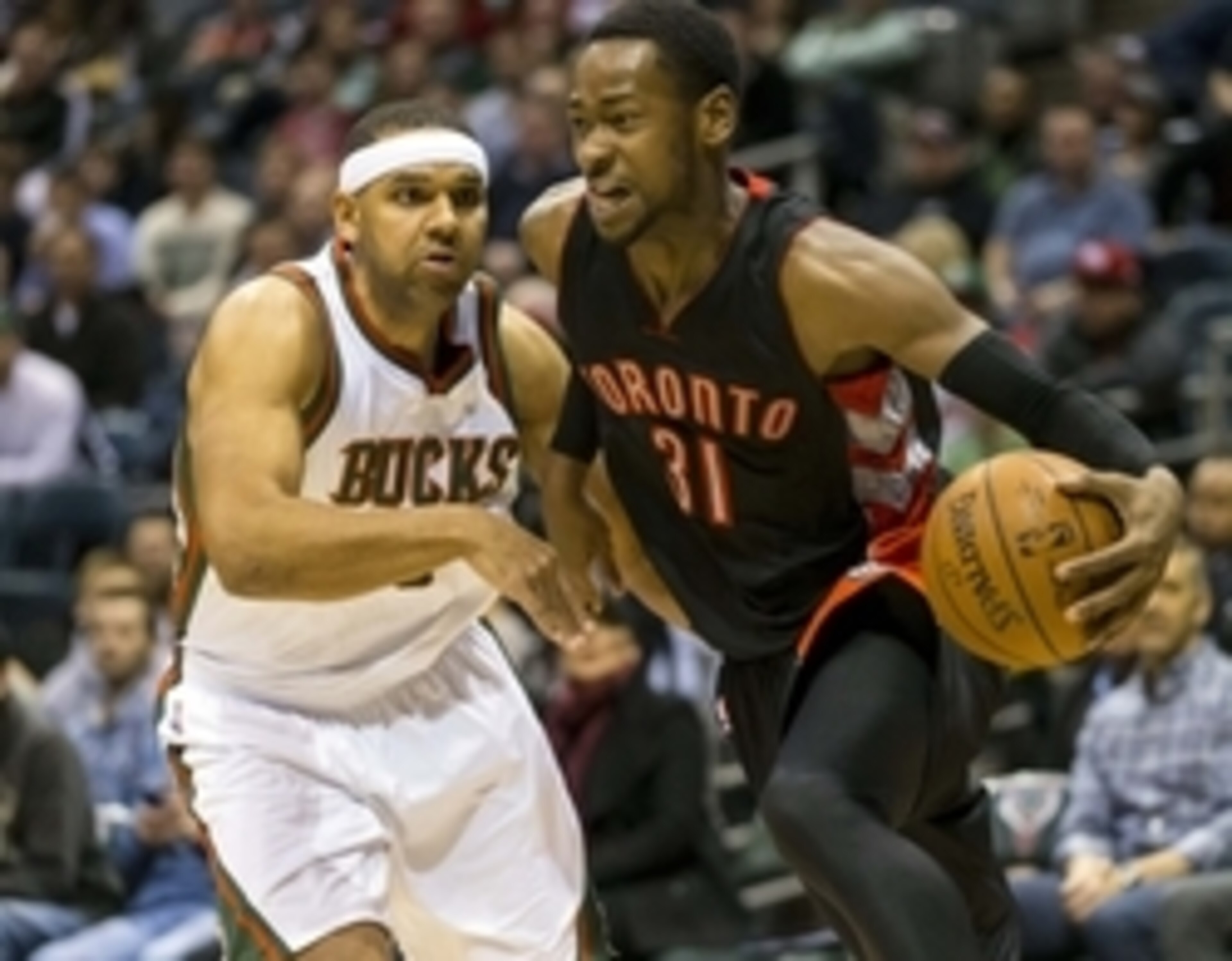 Jan 19, 2015; Milwaukee, WI, USA; Toronto Raptors forward Terrence Ross (31) drives for the basket around Milwaukee Bucks guard Jared Dudley (9) during the second quarter at BMO Harris Bradley Center. Mandatory Credit: Jeff Hanisch-USA TODAY Sports