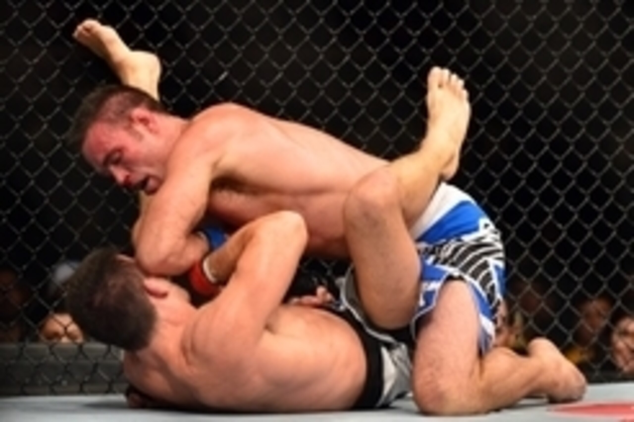 Oct 9, 2013; Barueri, Sao Paulo, Brazil; Demian Maia (red gloves) fights against Jake Shields (blue gloves) during UFC Fight Night 29 at Jose Correa Arena. Mandatory Credit: Jason Silva-USA TODAY Sports