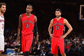 NEW YORK, NY - OCTOBER 13:  Terrence Ross #31 and Greivis Vasquez #21 of the Toronto Raptors watch during a game against the New York Knicks at Madison Square Garden on October 13, 2014 in New York City, New York. NOTE TO USER: User expressly acknowledges