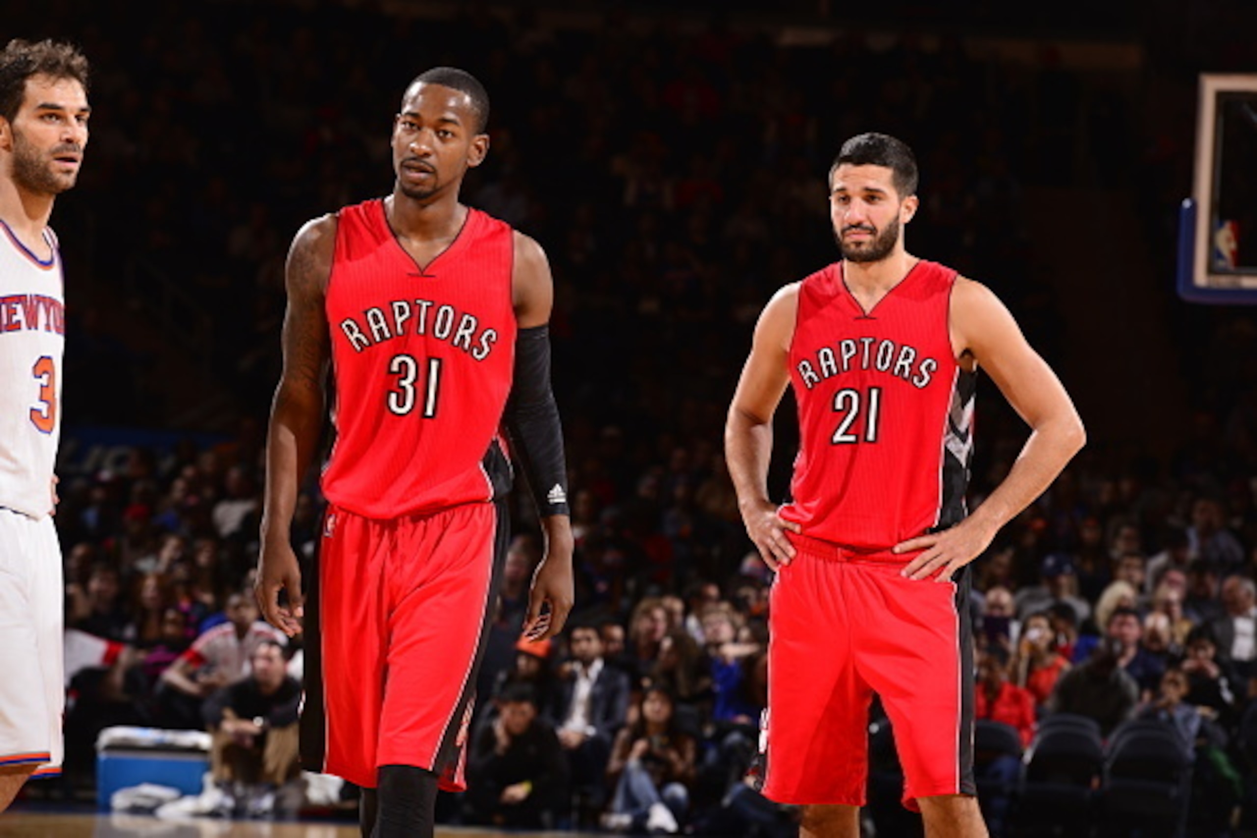 NEW YORK, NY - OCTOBER 13:  Terrence Ross #31 and Greivis Vasquez #21 of the Toronto Raptors watch during a game against the New York Knicks at Madison Square Garden on October 13, 2014 in New York City, New York. NOTE TO USER: User expressly acknowledges