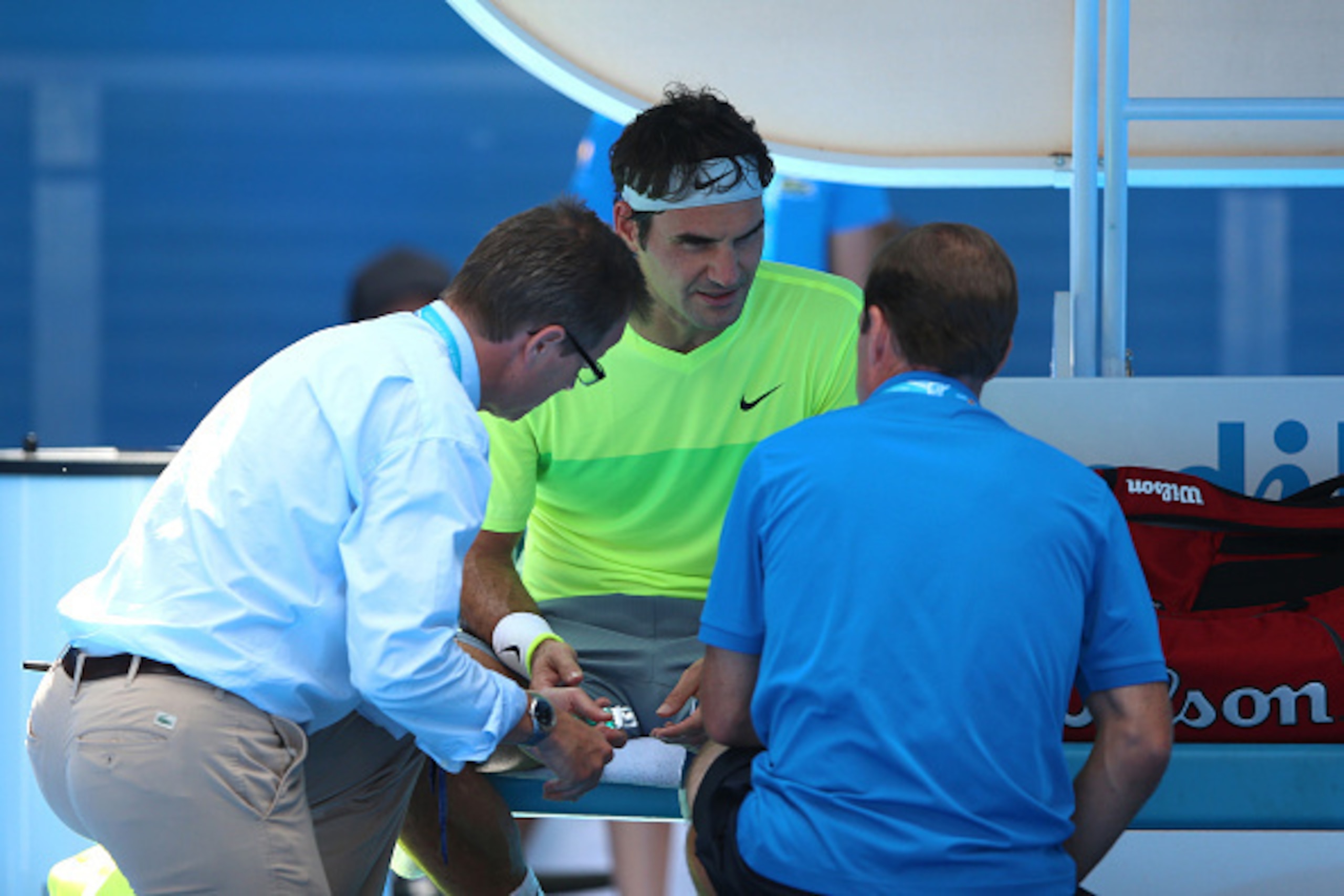 MELBOURNE, AUSTRALIA - JANUARY 21:  Roger Federer of Switzerland receives medical attention in his second round match against Simone Bolelli of Italy during day three of the 2015 Australian Open at Melbourne Park on January 21, 2015 in Melbourne, Australi