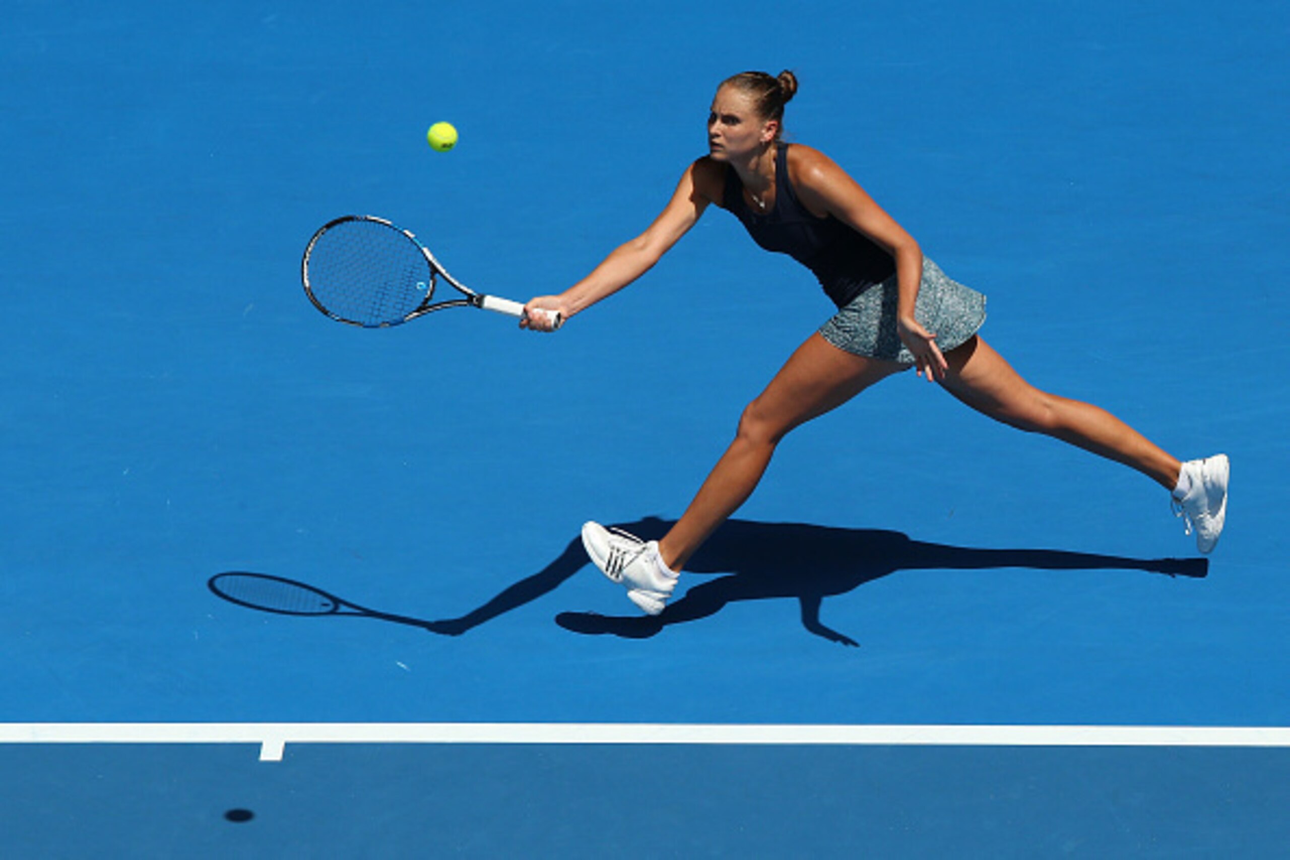 MELBOURNE, AUSTRALIA - JANUARY 21:  Alexandra Panova of Russia plays a forehand in her second round match against Maria Sharapova of Russia during day three of the 2015 Australian Open at Melbourne Park on January 21, 2015 in Melbourne, Australia.  (Photo