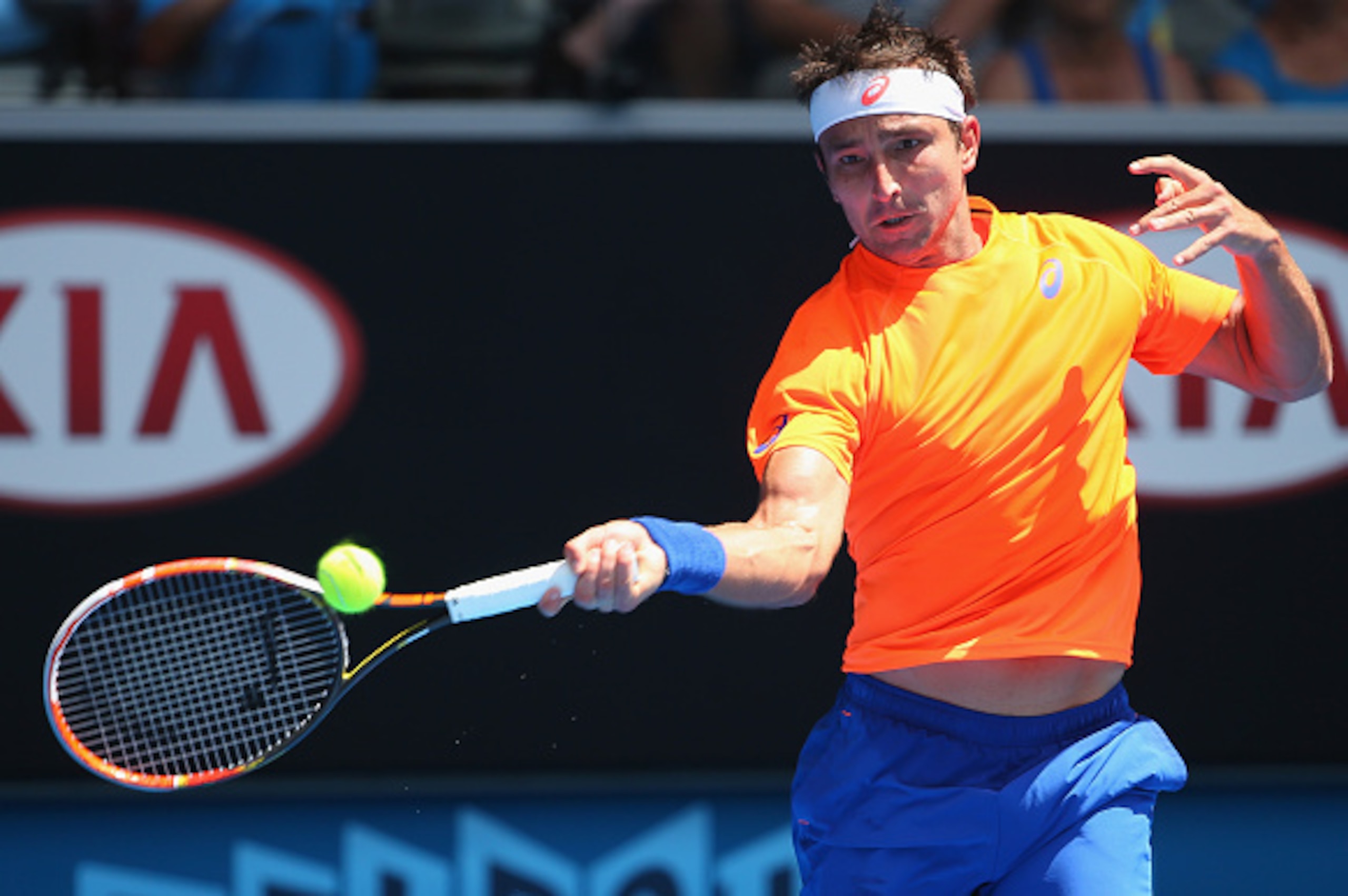 MELBOURNE, AUSTRALIA - JANUARY 21:  Marinko Matosevic of Australia plays a forehand in his second round match against Andy Murray of Great Britain during day three of the 2015 Australian Open at Melbourne Park on January 21, 2015 in Melbourne, Australia. 