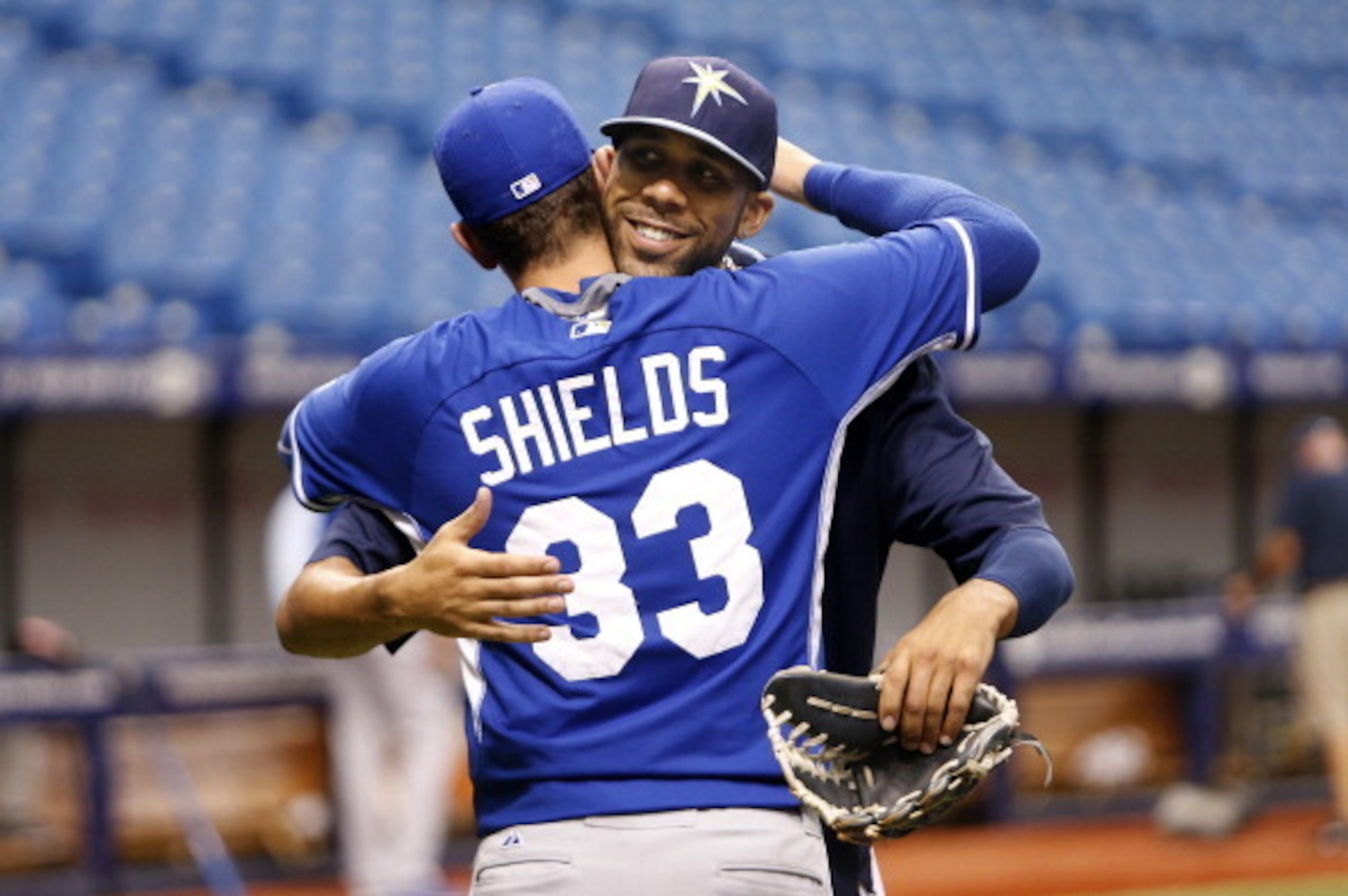 ST. PETERSBURG, FL - JULY 8:  Pitcher David Price #14 of the Tampa Bay Rays hugs fellow pitcher and former teammate James Shields #33 of the Kansas City Royals before the start of a game on July 8, 2014 at Tropicana Field in St. Petersburg, Florida.  (Pho