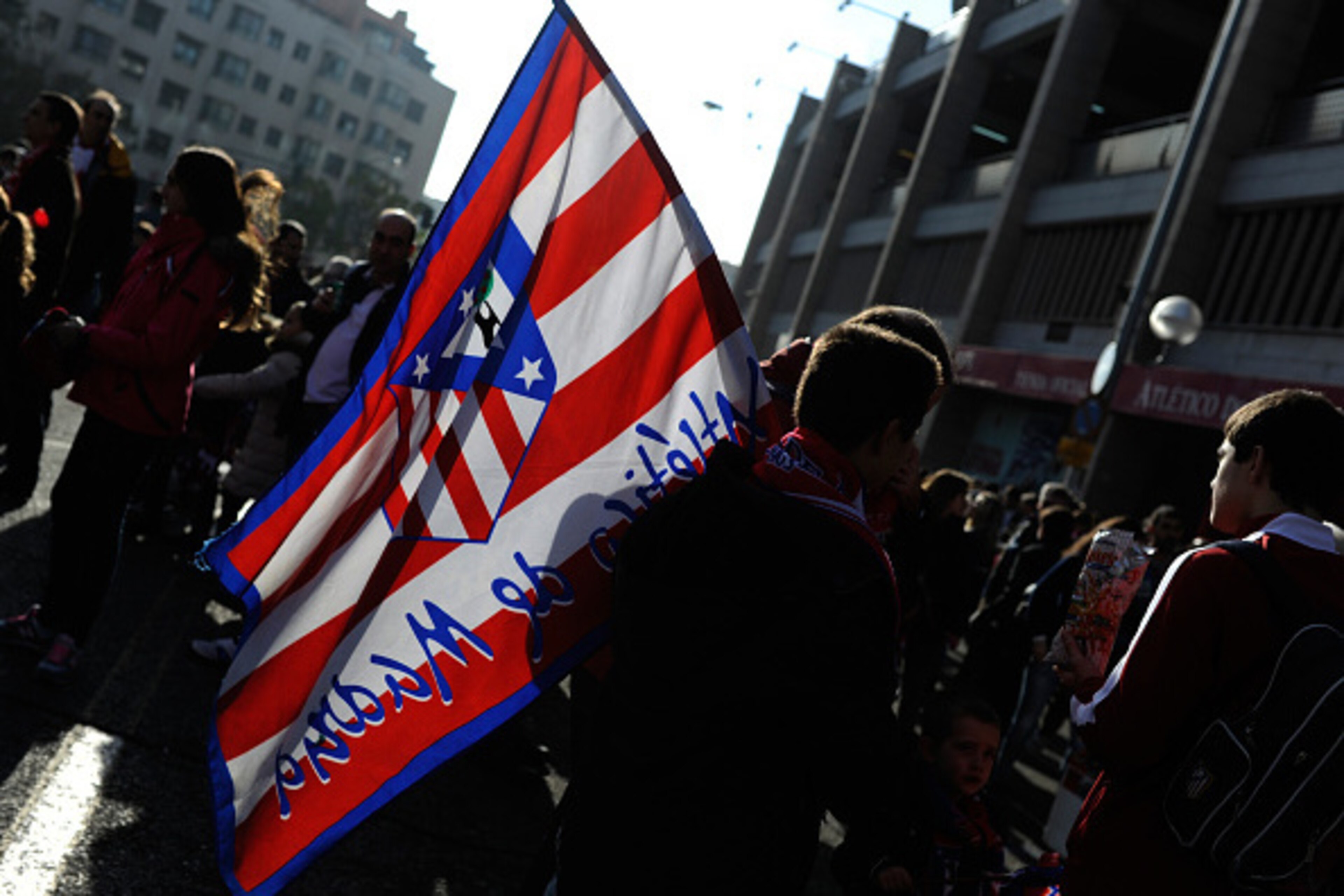 MADRID, SPAIN - NOVEMBER 30:  A Club Atletico de Madrid supporter arrives at the Vicente Calderon stadiun for the start of La Liga match between Club Atletico de Madrid and RC Deportivo La Coruna on November 30, 2014 in Madrid, Spain.  An RC Deportivo La 