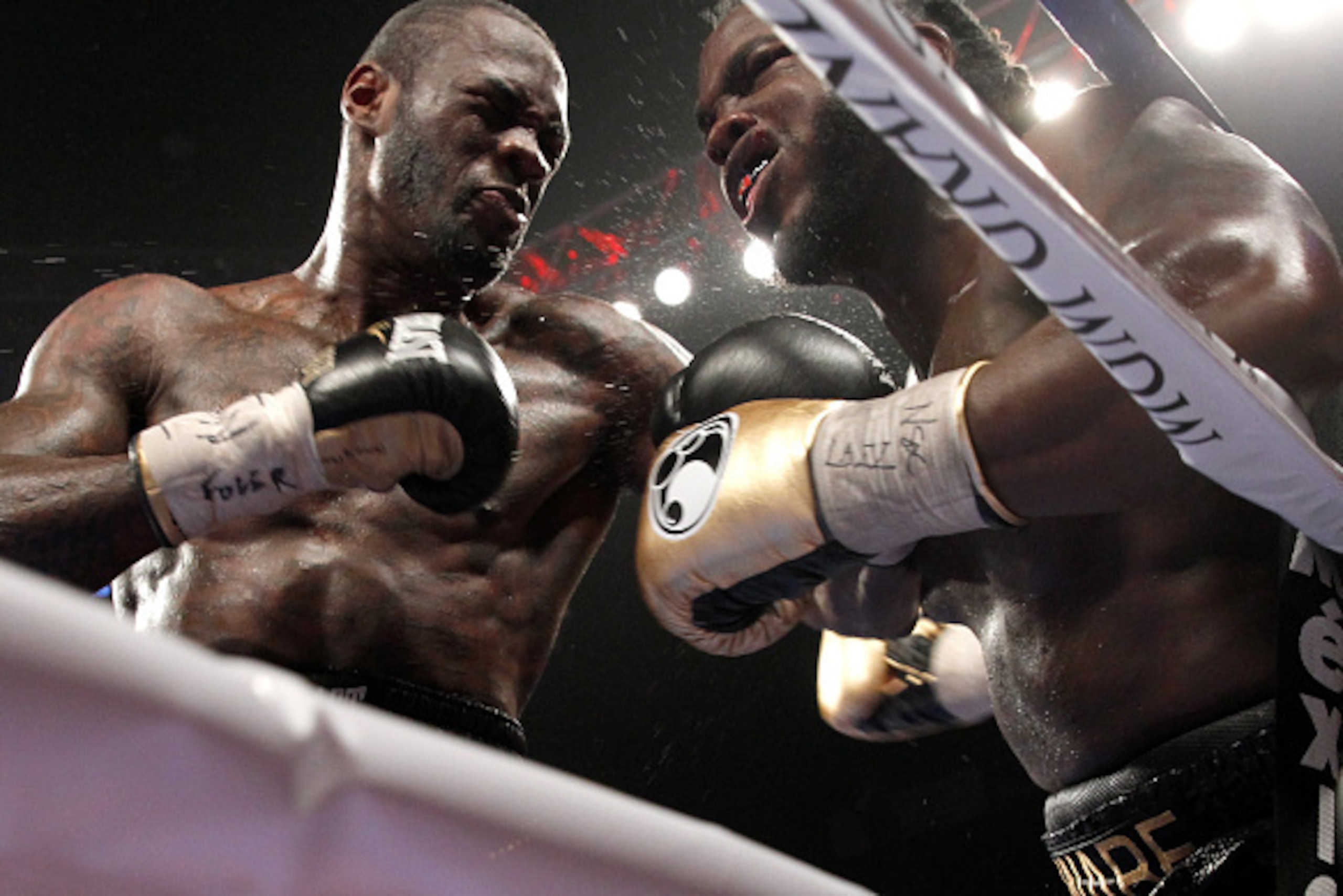 LAS VEGAS, NV - JANUARY 17:  Deontay Wilder (L) punches WBC heavyweight champion Bermane Stiverne against the ropes during their title fight at the MGM Grand Garden Arena on January 17, 2015 in Las Vegas, Nevada. Wilder took the title by unanimous decisio