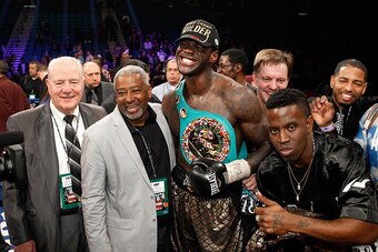 LAS VEGAS, NV - JANUARY 17:  Deontay Wilder poses with members of his camp after defeating WBC heavyweight champion Bermane Stiverne at the MGM Grand Garden Arena on January 17, 2015 in Las Vegas, Nevada. Wilder took the title by unanimous decision.  (Pho