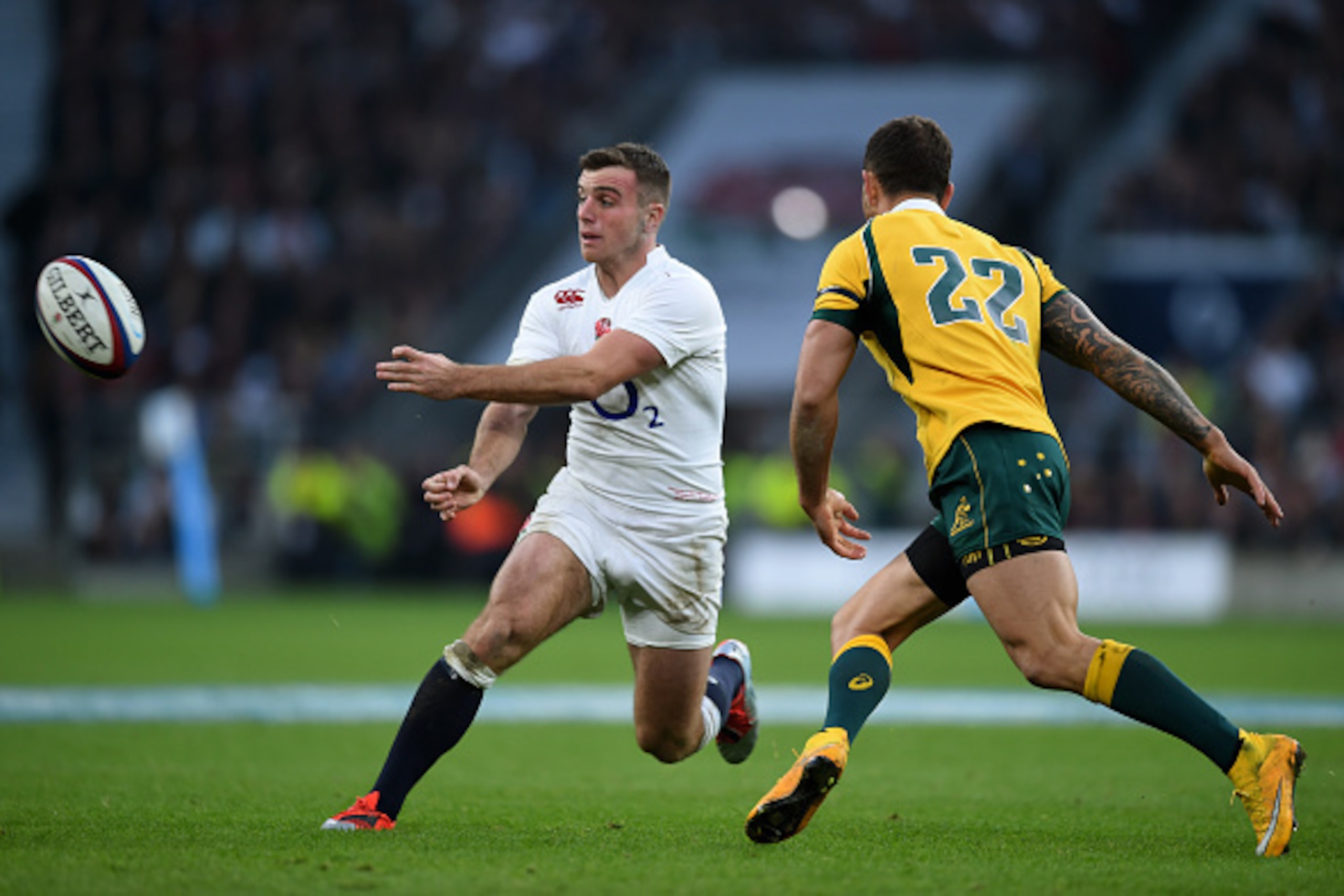 LONDON, ENGLAND - NOVEMBER 29:  George Ford of Australia passes the ball alongside Quade Cooper of Australia during the QBE international match between England and Australia at Twickenham Stadium on November 29, 2014 in London, England.  (Photo by Paul Gi