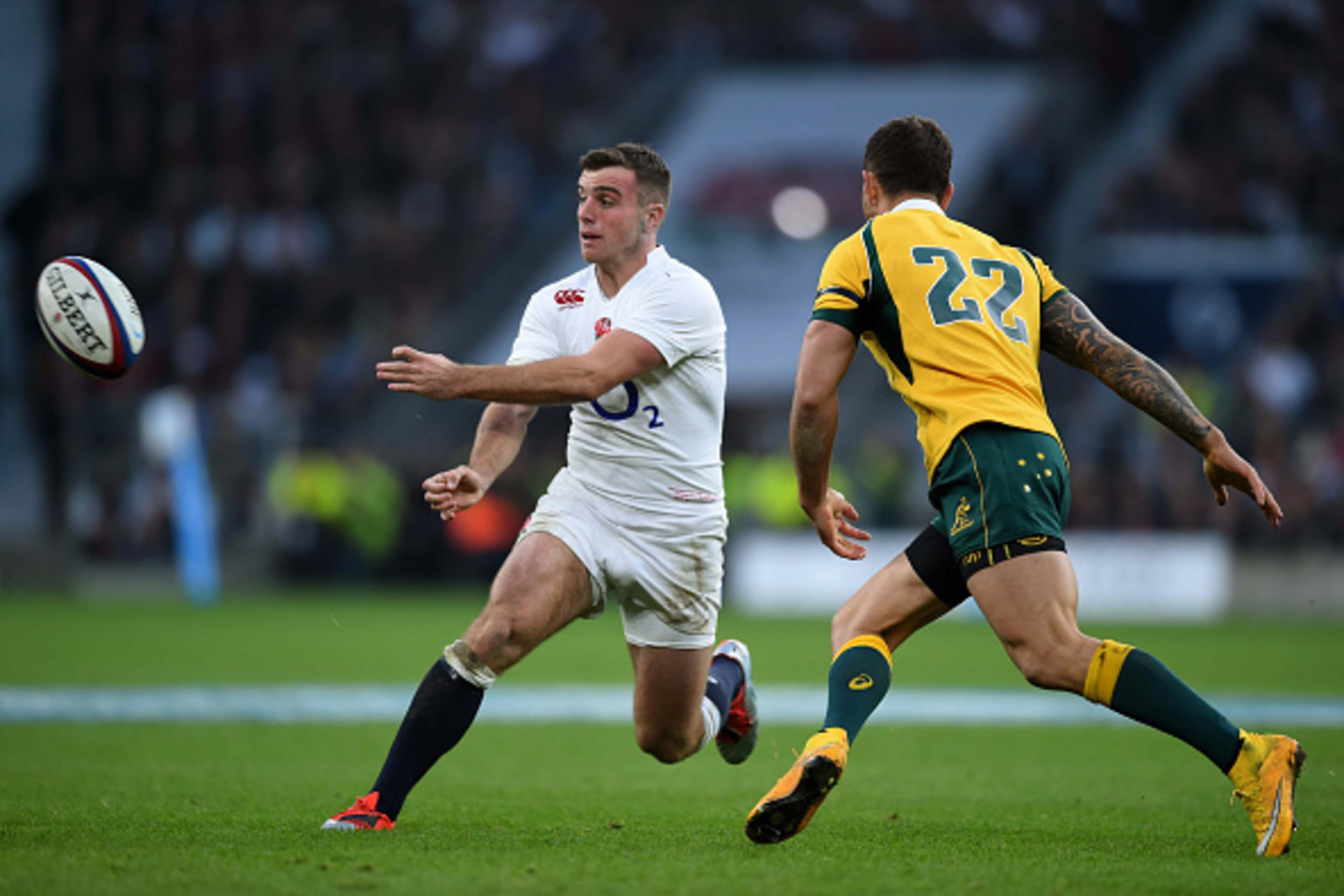 LONDON, ENGLAND - NOVEMBER 29:  George Ford of Australia passes the ball alongside Quade Cooper of Australia during the QBE international match between England and Australia at Twickenham Stadium on November 29, 2014 in London, England.  (Photo by Paul Gi