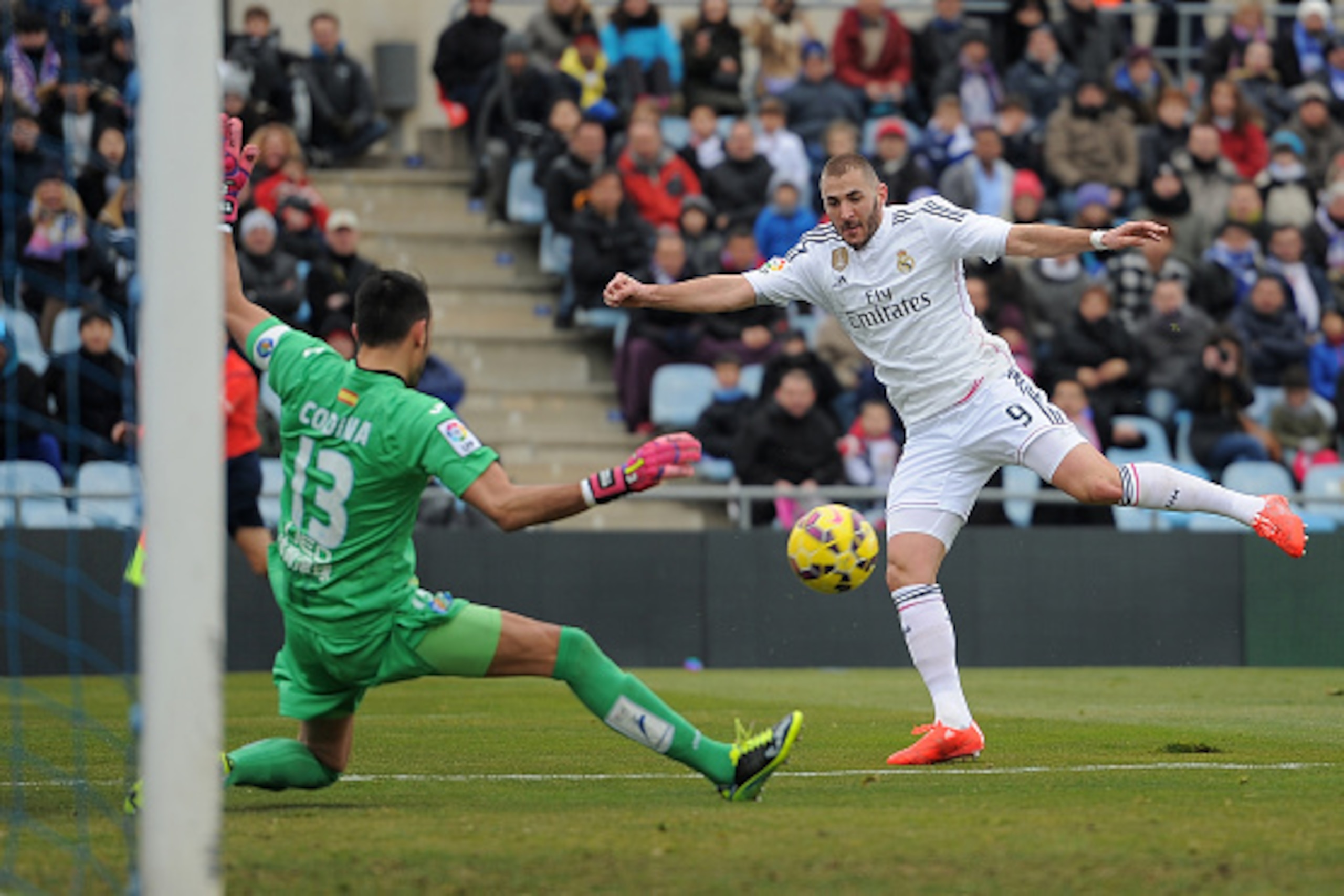 GETAFE, SPAIN - JANUARY 18: Karim Benzema of Real Madrid shoots past Jordi Codina of Getafe CF during the La Liga match between Getafe CF and Real Madrid CF at Coliseum Alfonso Perez stadium on January 18, 2015 in Getafe, Spain. (Photo by Denis Doyle/G GETAFE, SPAIN - JANUARY 18: Karim Benzema of Real Madrid shoots past Jordi Codina of Getafe CF during the La Liga match between Getafe CF and Real Madrid CF at Coliseum Alfonso Perez stadium on January 18, 2015 in Getafe, Spain. (Photo by Denis Doyle/G