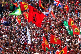 MONZA, ITALY - SEPTEMBER 07:  Fans gather under the podium following the F1 Grand Prix of Italy at Autodromo di Monza on September 7, 2014 in Monza, Italy.  (Photo by Mark Thompson/Getty Images)