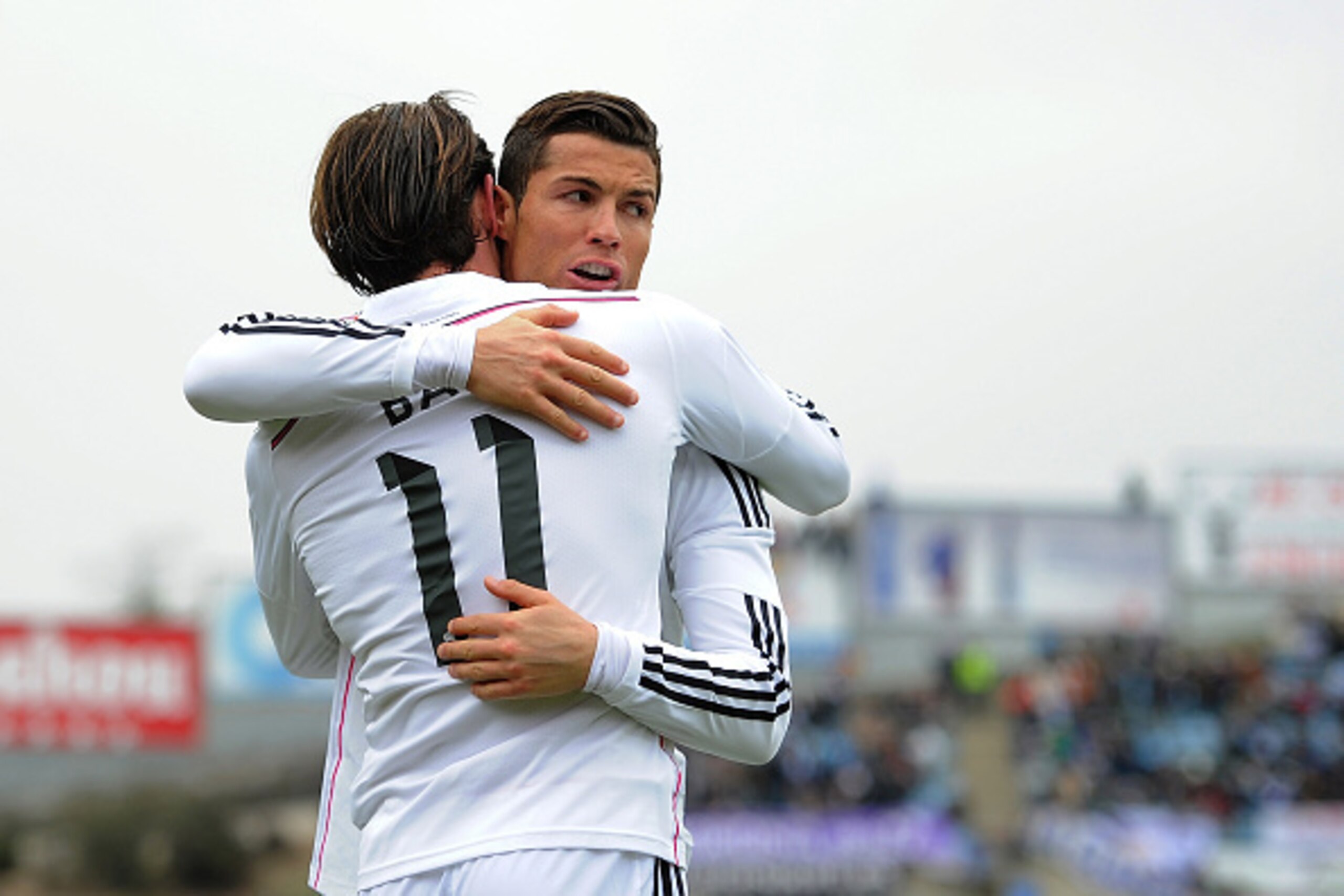 GETAFE, SPAIN - JANUARY 18:  Gareth Bale of Real Madrid celebrates with Cristiano Ronaldo after scoring his team's 2nd goal during the La Liga match between Getafe CF and Real Madrid CF at Coliseum Alfonso Perez stadium on January 18, 2015 in Getafe, Spai