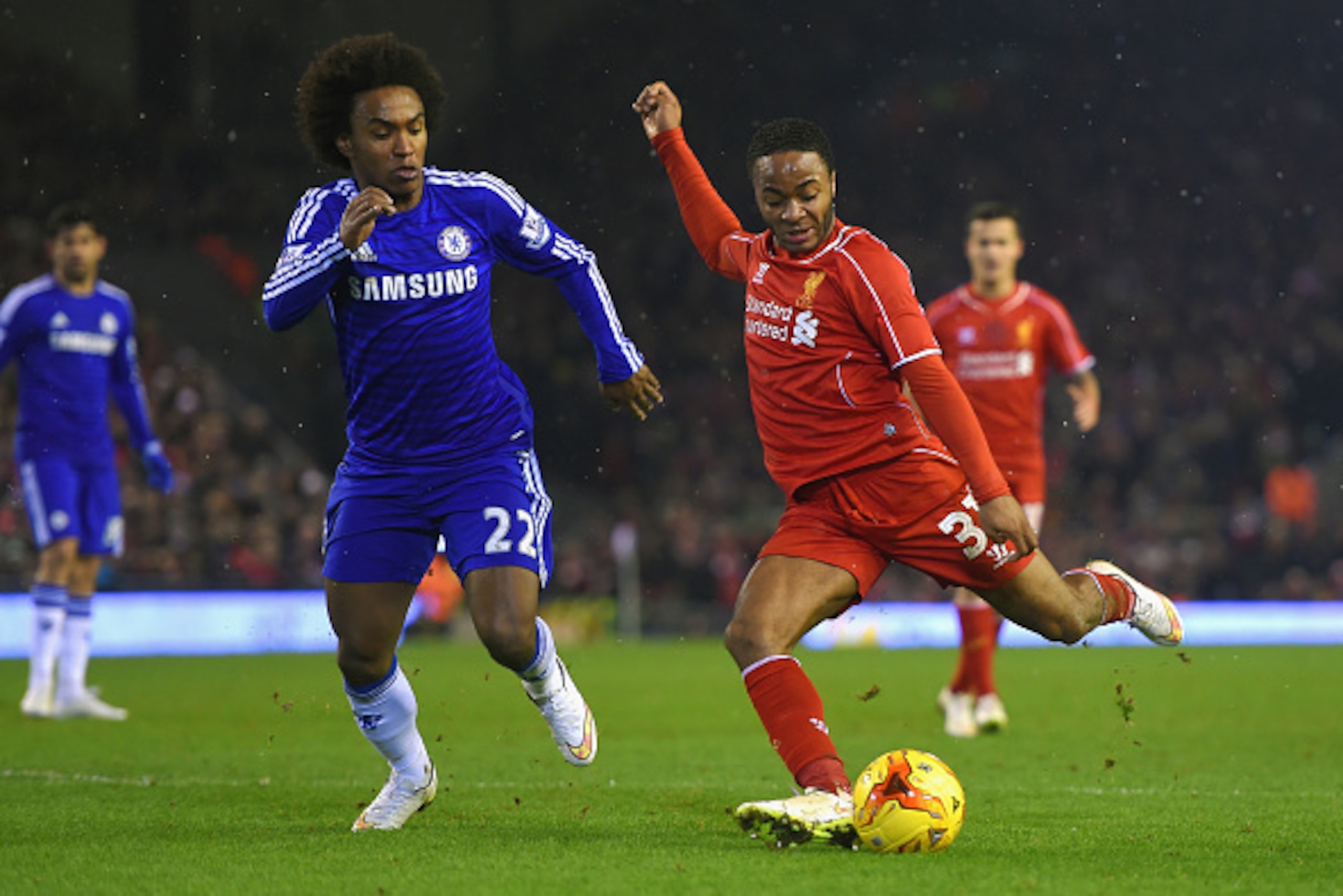 LIVERPOOL, ENGLAND - JANUARY 20:  Willian of Chelsea closes down Raheem Sterling of Liverpool during the Capital One Cup Semi-Final first leg match between Liverpool and Chelsea at Anfield on January 20, 2015 in Liverpool, England.  (Photo by Michael Rega