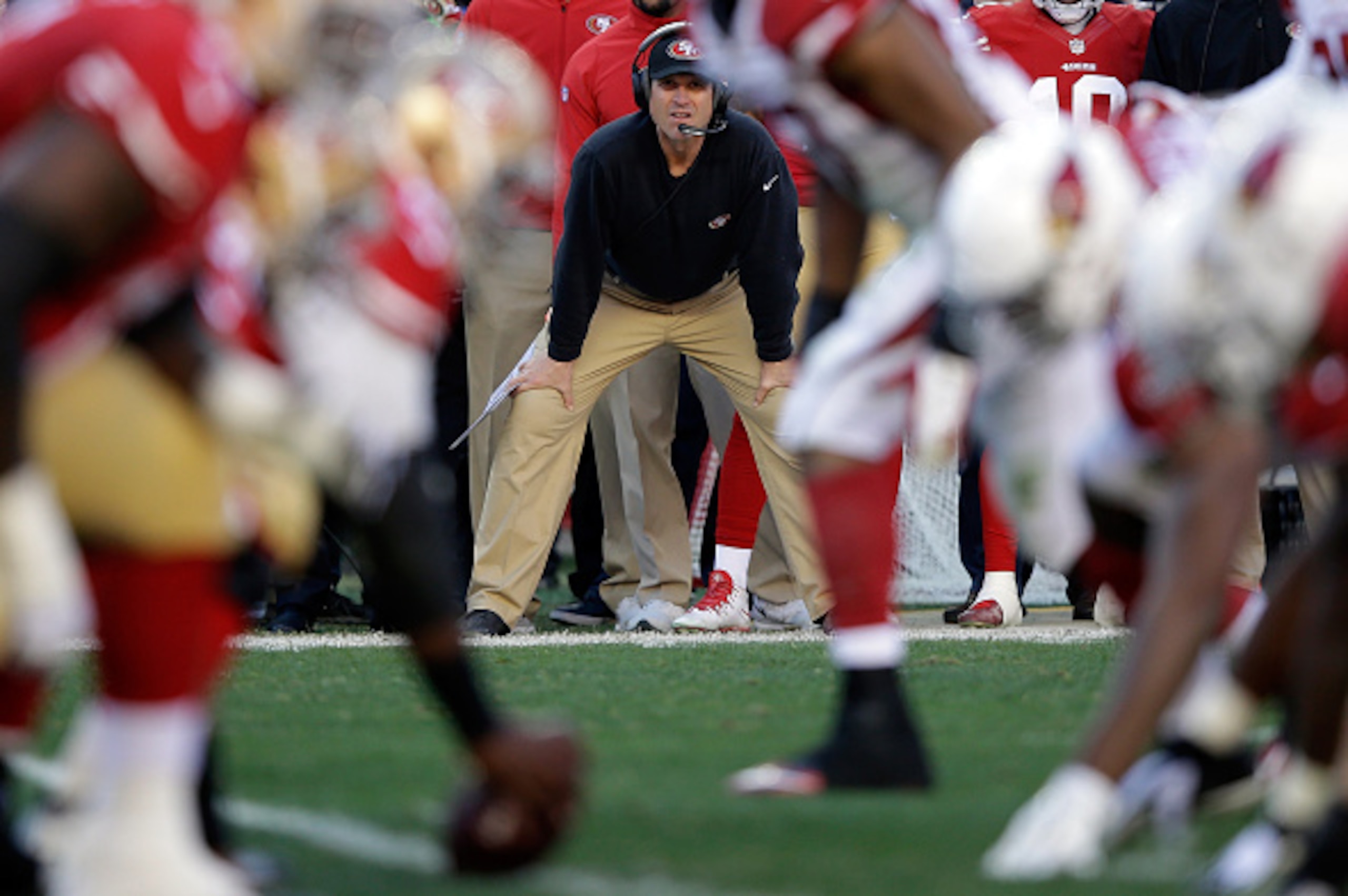SANTA CLARA, CA - DECEMBER 28:  Head coach Jim Harbaugh of the San Francisco 49ers watches his team during their game against the Arizona Cardinals at Levi's Stadium on December 28, 2014 in Santa Clara, California.  (Photo by Ezra Shaw/Getty Images)