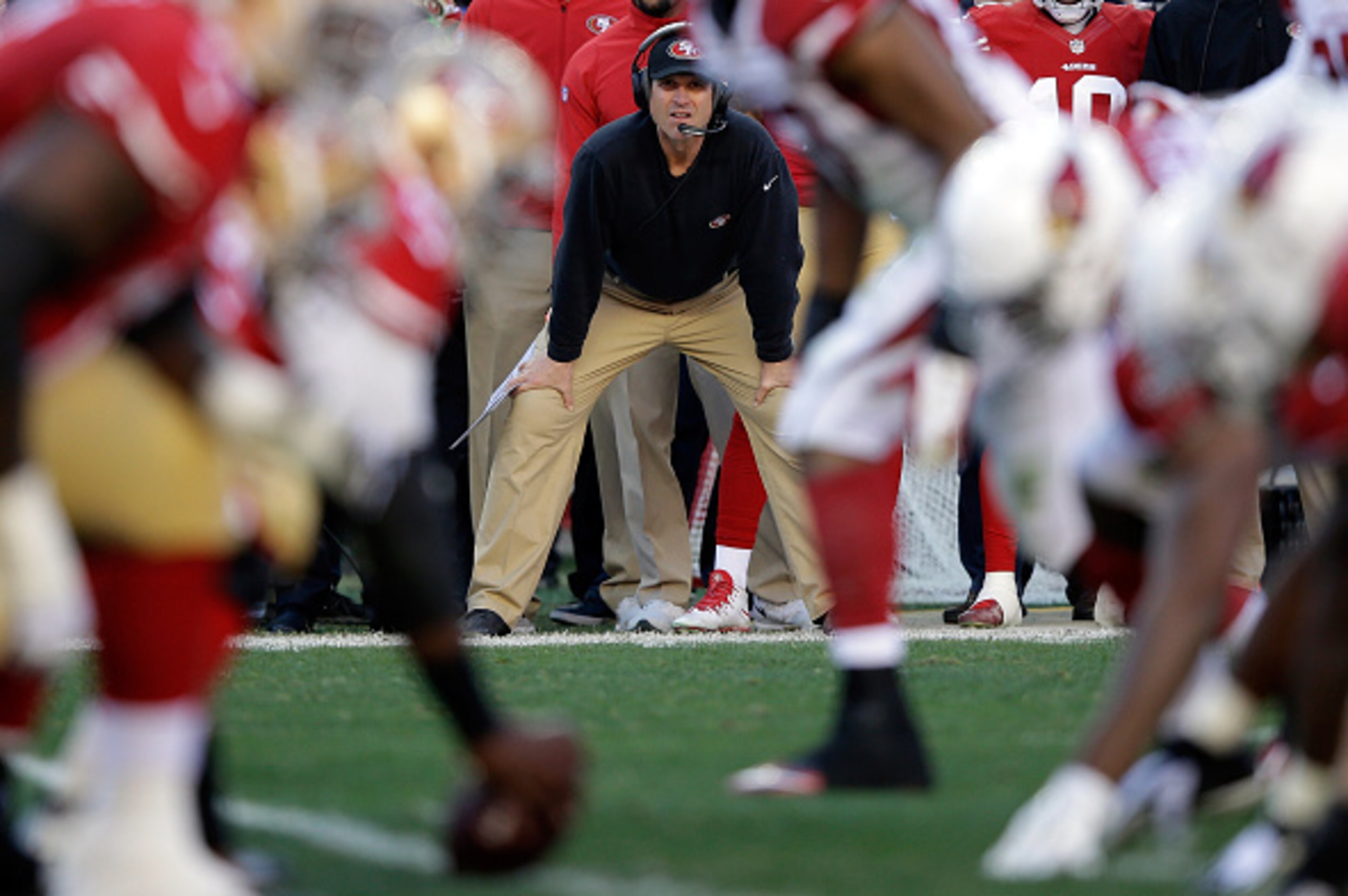 SANTA CLARA, CA - DECEMBER 28:  Head coach Jim Harbaugh of the San Francisco 49ers watches his team during their game against the Arizona Cardinals at Levi's Stadium on December 28, 2014 in Santa Clara, California.  (Photo by Ezra Shaw/Getty Images)