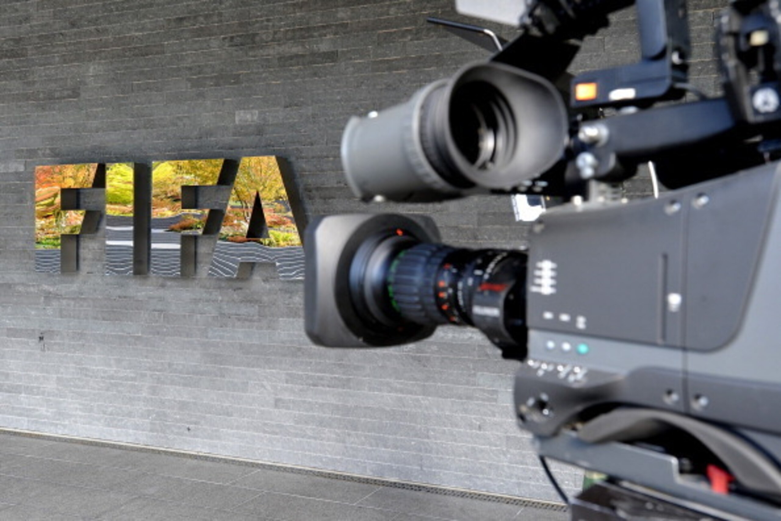 ZURICH, SWITZERLAND - OCTOBER 20:  A camera is seen by the FIFA logo outside the FIFA headquarters prior to the FIFA Executive Committee Meeting on October 20, 2011 in Zurich, Switzerland. During their third meeting of the year, held over two days, the FI
