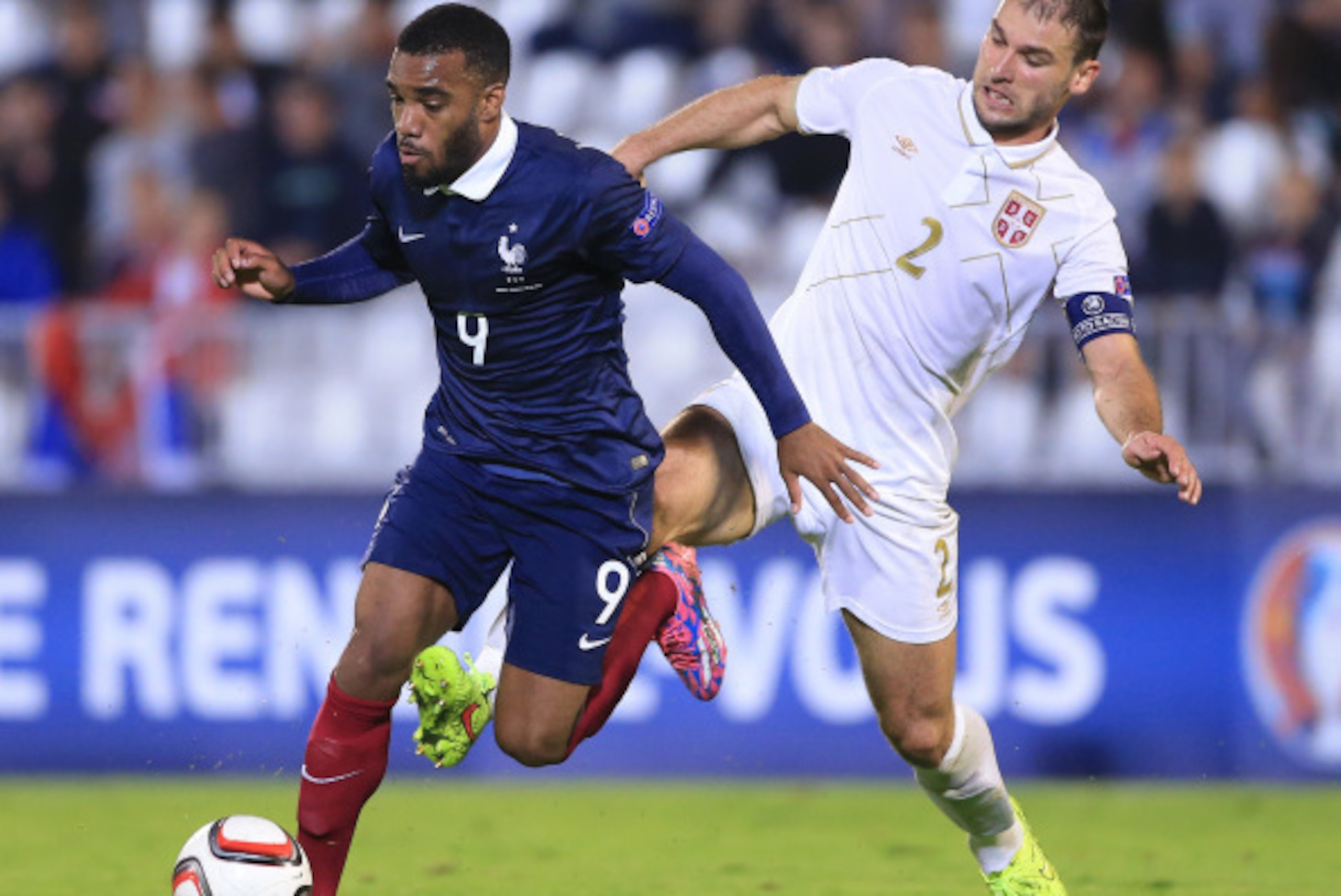 BELGRADE, SERBIA - SEPTEMBER 07: Alexandre Lacazette (L) of France is challenged by Branislav Ivanovic (R) of Serbia during the International friendly match between Serbia and France at the Stadium JNA on September 07, 2014 in Belgrade, Serbia, 2014. (Pho BELGRADE, SERBIA - SEPTEMBER 07: Alexandre Lacazette (L) of France is challenged by Branislav Ivanovic (R) of Serbia during the International friendly match between Serbia and France at the Stadium JNA on September 07, 2014 in Belgrade, Serbia, 2014. (Pho