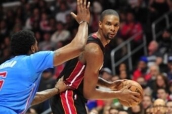 January 11, 2015; Los Angeles, CA, USA; Miami Heat center Chris Bosh (1) controls the ball against the defense of Los Angeles Clippers center DeAndre Jordan (6) during the first half at Staples Center. Mandatory Credit: Gary A. Vasquez-USA TODAY Sports