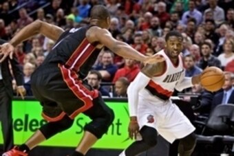Jan 8, 2015; Portland, OR, USA; Portland Trail Blazers guard Wesley Matthews (2) drives past Miami Heat center Chris Bosh (1) during the fourth quarter at the Moda Center. Mandatory Credit: Craig Mitchelldyer-USA TODAY Sports