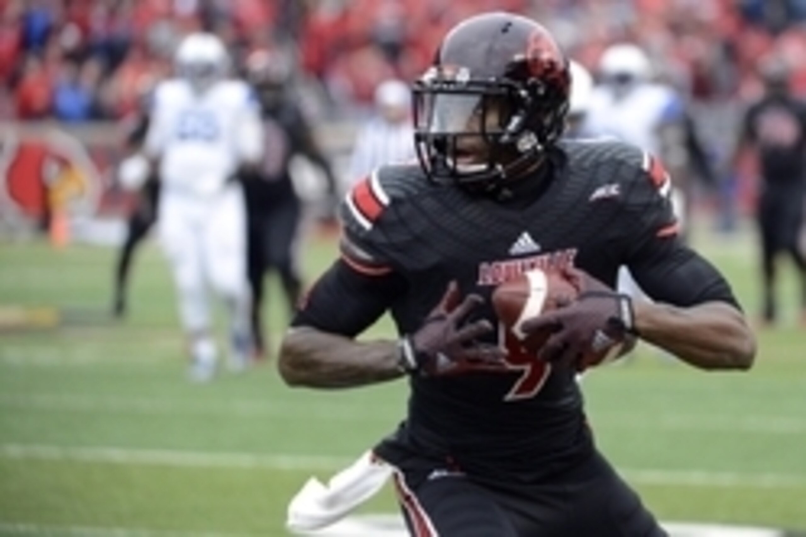 Nov 29, 2014; Louisville, KY, USA; Louisville Cardinals wide receiver DeVante Parker (9) runs the ball against the Kentucky Wildcats during the second half at Papa John's Cardinal Stadium. Louisville defeated Kentucky 44-40.  Mandatory Credit: Jamie Rhode