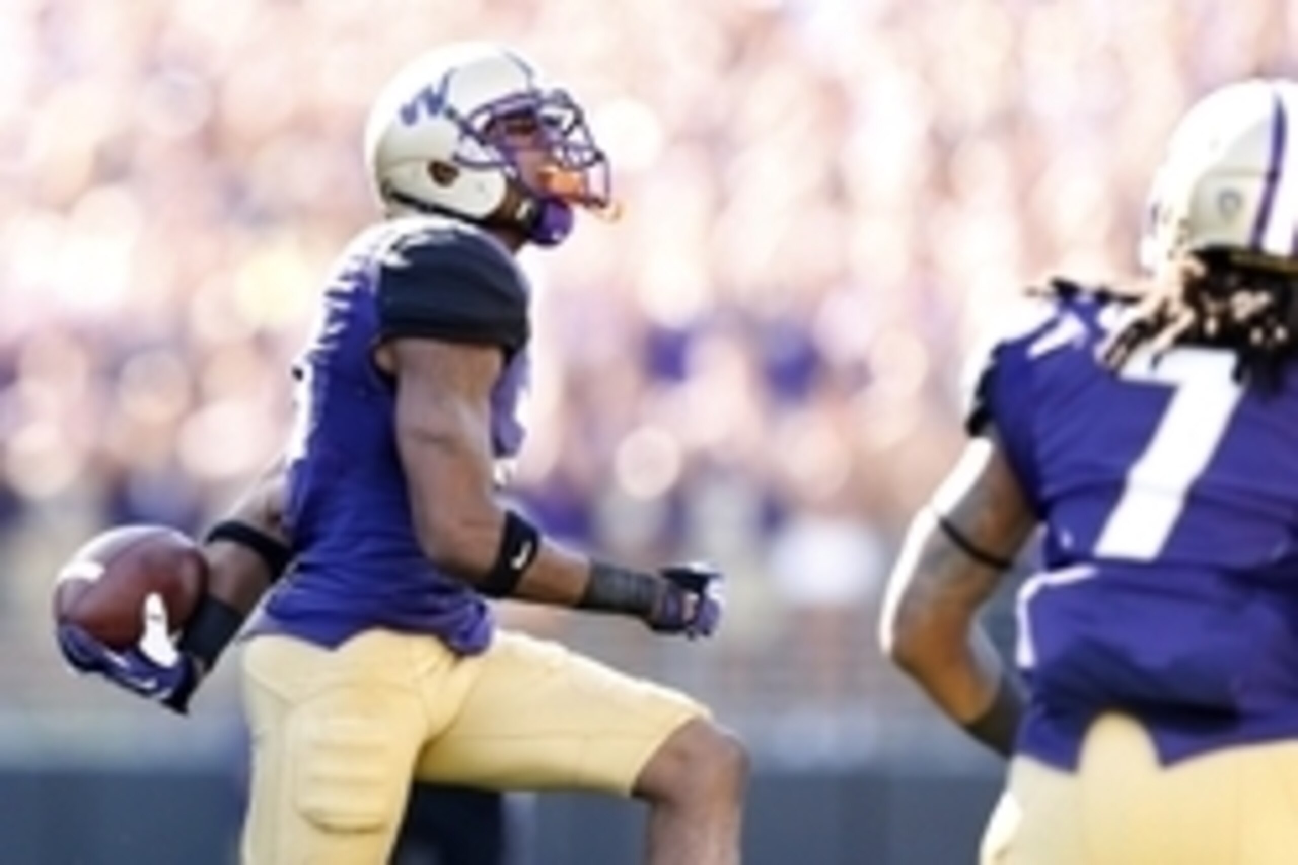 Sep 20, 2014; Seattle, WA, USA; Washington Huskies defensive back Marcus Peters (21) celebrates his interception against the Georgia State Panthers during the first quarter at Husky Stadium. Mandatory Credit: Joe Nicholson-USA TODAY Sports