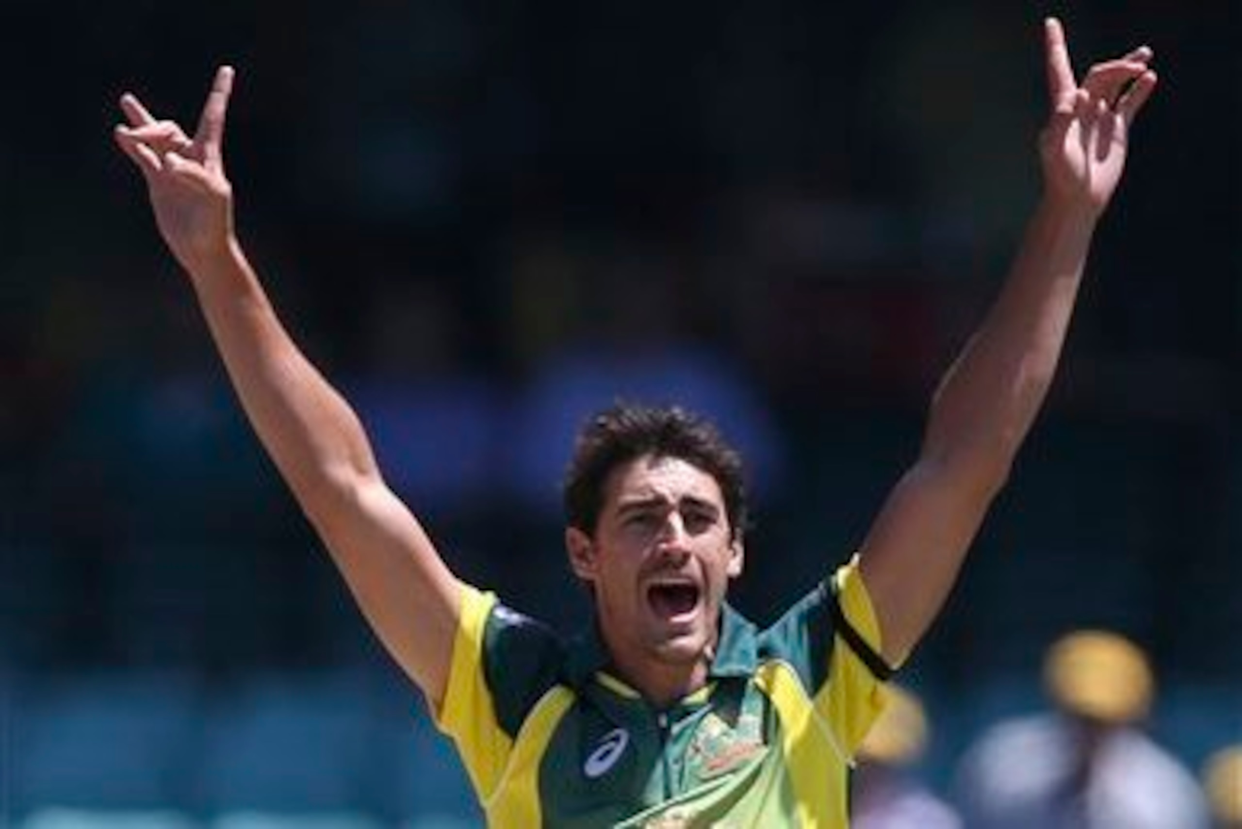 Mitchell Starc celebrates a wicket in the win over England.