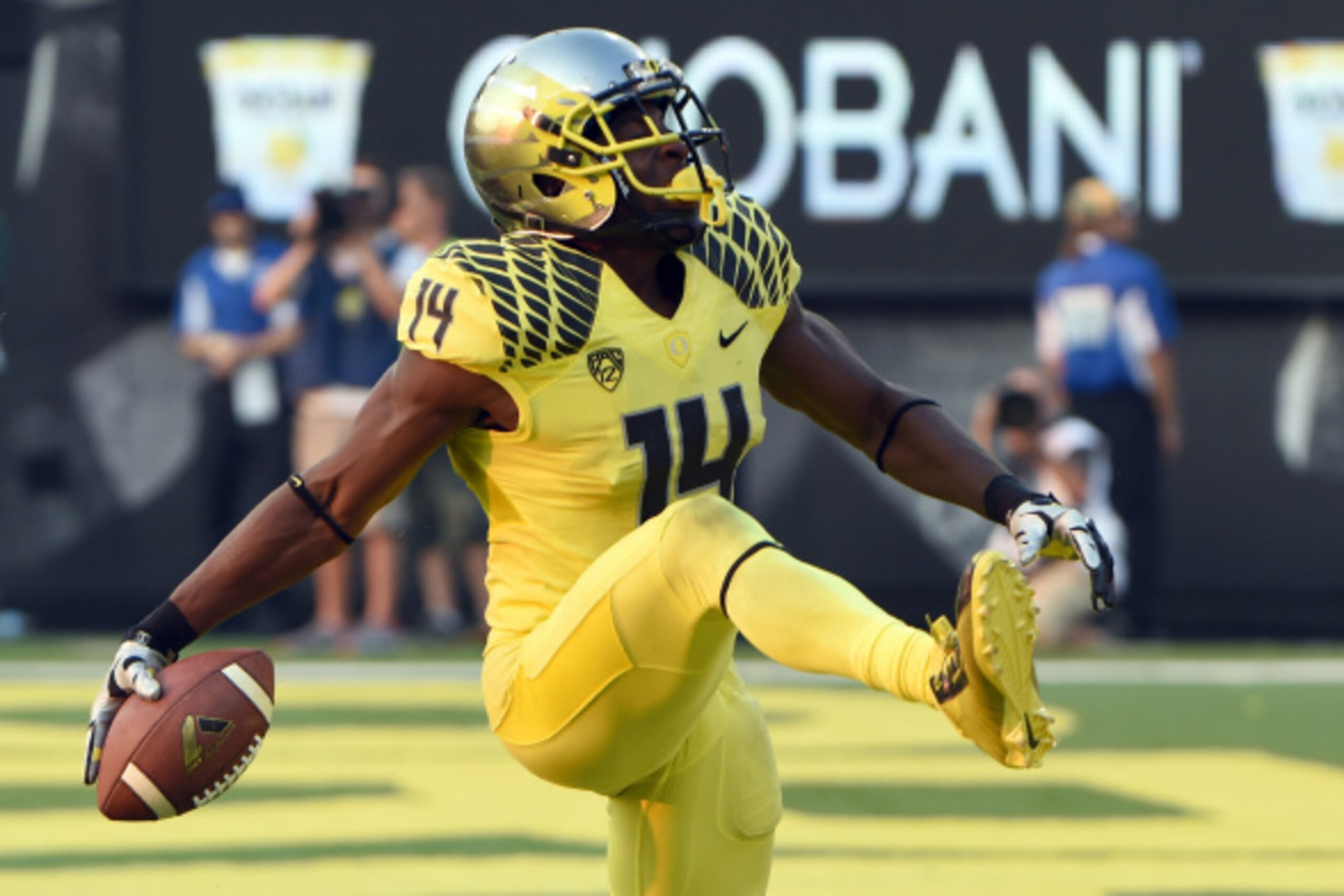 EUGENE, OR -SEPTEMBER 06: Defensive back Ifo Ekpre-Olomu #14 of the Oregon Ducks celebrates after intercepting a pass during the fourth quarter of the game against the Michigan State Spartans at Autzen Stadium on September 6, 2014 in Eugene, Oregon. Orego