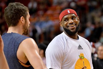 Dec 25, 2014; Miami, FL, USA; Cleveland Cavaliers forward LeBron James (right) laughs with Cleveland Cavaliers forward Kevin Love (left) before their game against the Miami Heat at American Airlines Arena. Mandatory Credit: Steve Mitchell-USA TODAY Sports