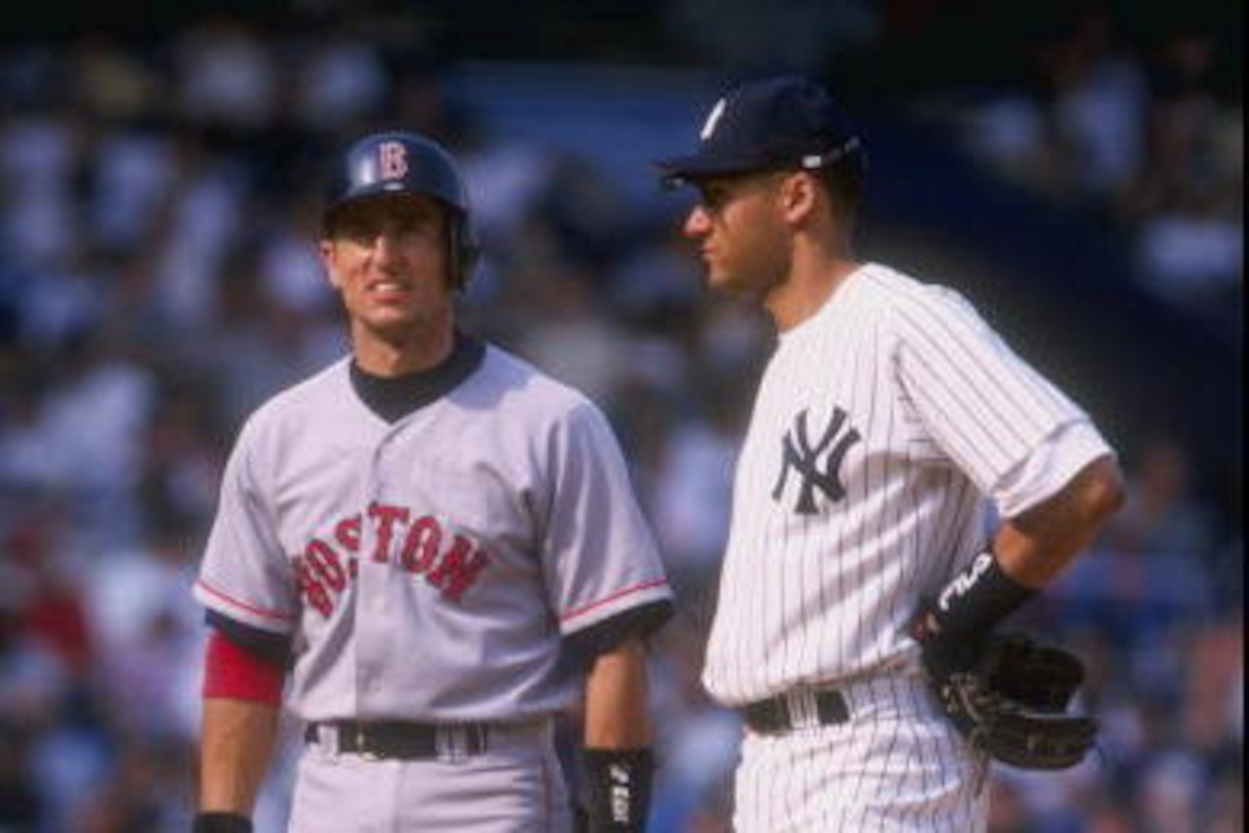 31 May 1998:  Nomar Garciaparra #5 of the Boston Red Sox talks with Derek Jeter #2 of the New York Yankees at Yankee Stadium in the Bronx, New York. The Red Sox defeated the Yankees 13-7. Mandatory Credit: David Seelig  /Allsport