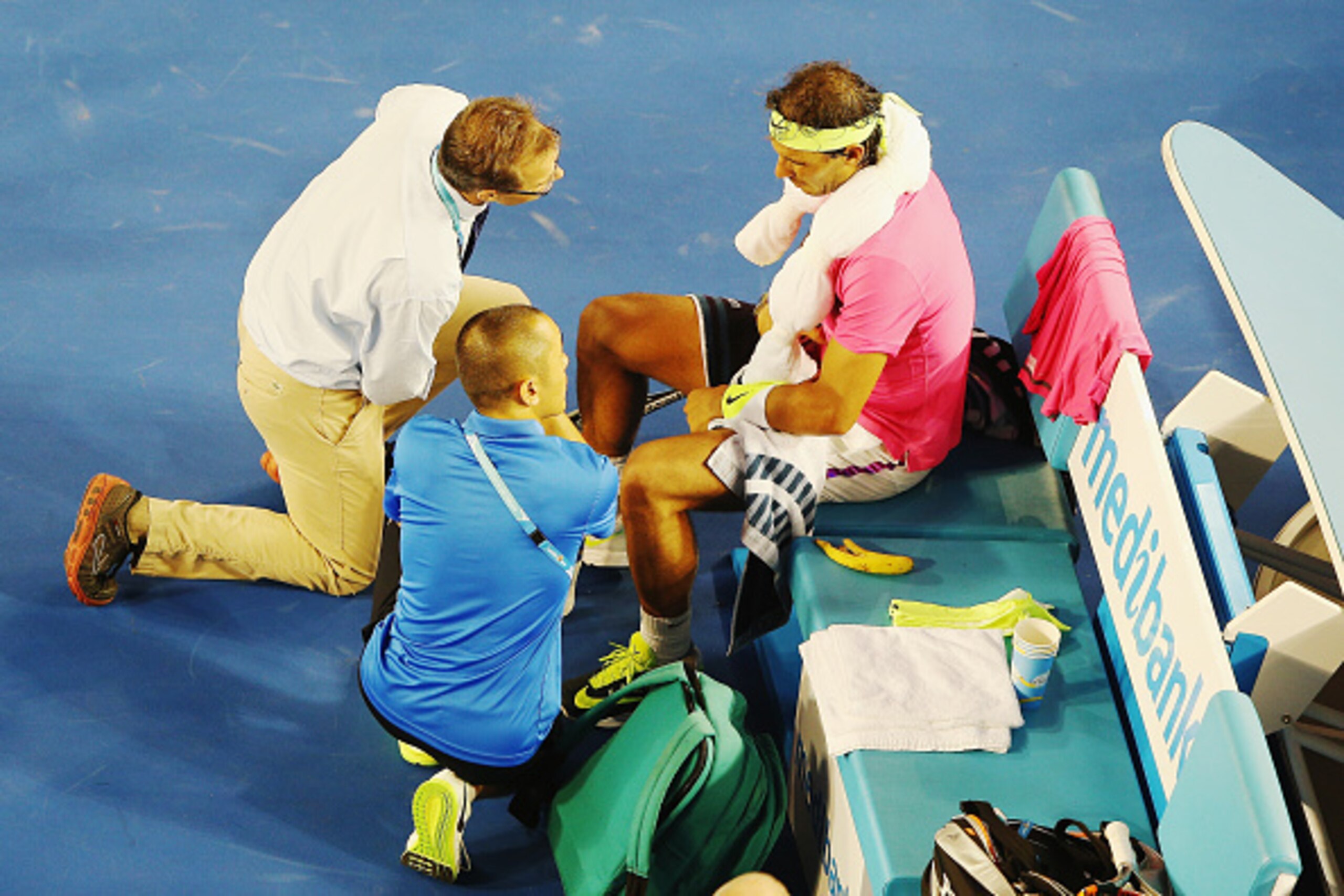 MELBOURNE, AUSTRALIA - JANUARY 21:  Rafael Nadal of Spain talks to his doctors in his second round match against Tim Smyczek of USA during day three of the 2015 Australian Open at Melbourne Park on January 21, 2015 in Melbourne, Australia.  (Photo by Hann