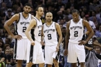 May 14, 2014; San Antonio, TX, USA; San Antonio Spurs players (from left) Tim Duncan, and Manu Ginobili, and Tony Parker, and Kawhi Leonard after a timeout against the Portland Trail Blazers in game five of the second round of the 2014 NBA Playoffs at AT&