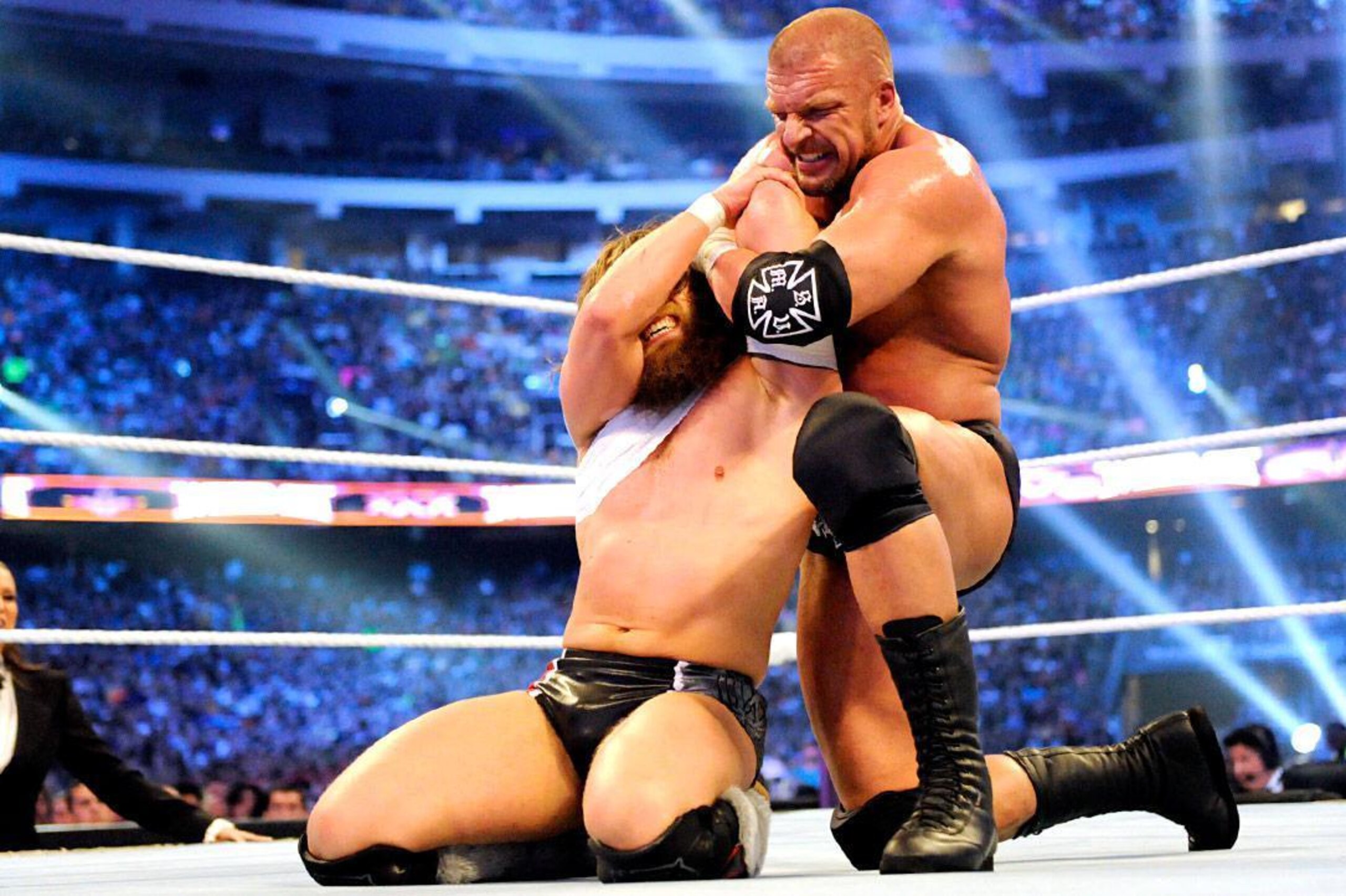 Triple H battles Daniel Bryan.