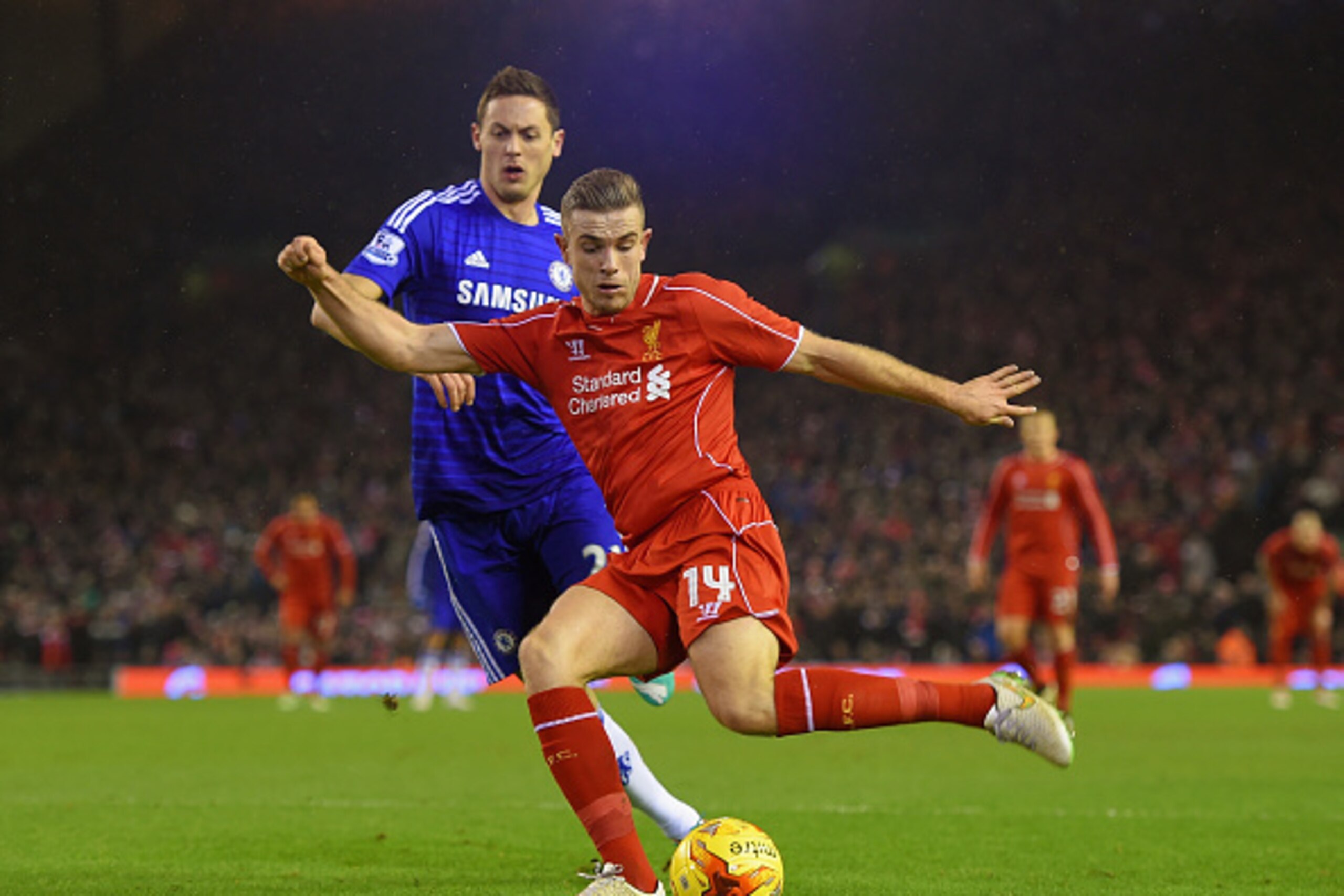 LIVERPOOL, ENGLAND - JANUARY 20: Jordan Henderson of Liverpool is closed down by Nemanja Matic of Chelsea during the Capital One Cup Semi-Final first leg match between Liverpool and Chelsea at Anfield on January 20, 2015 in Liverpool, England.  (Photo by 