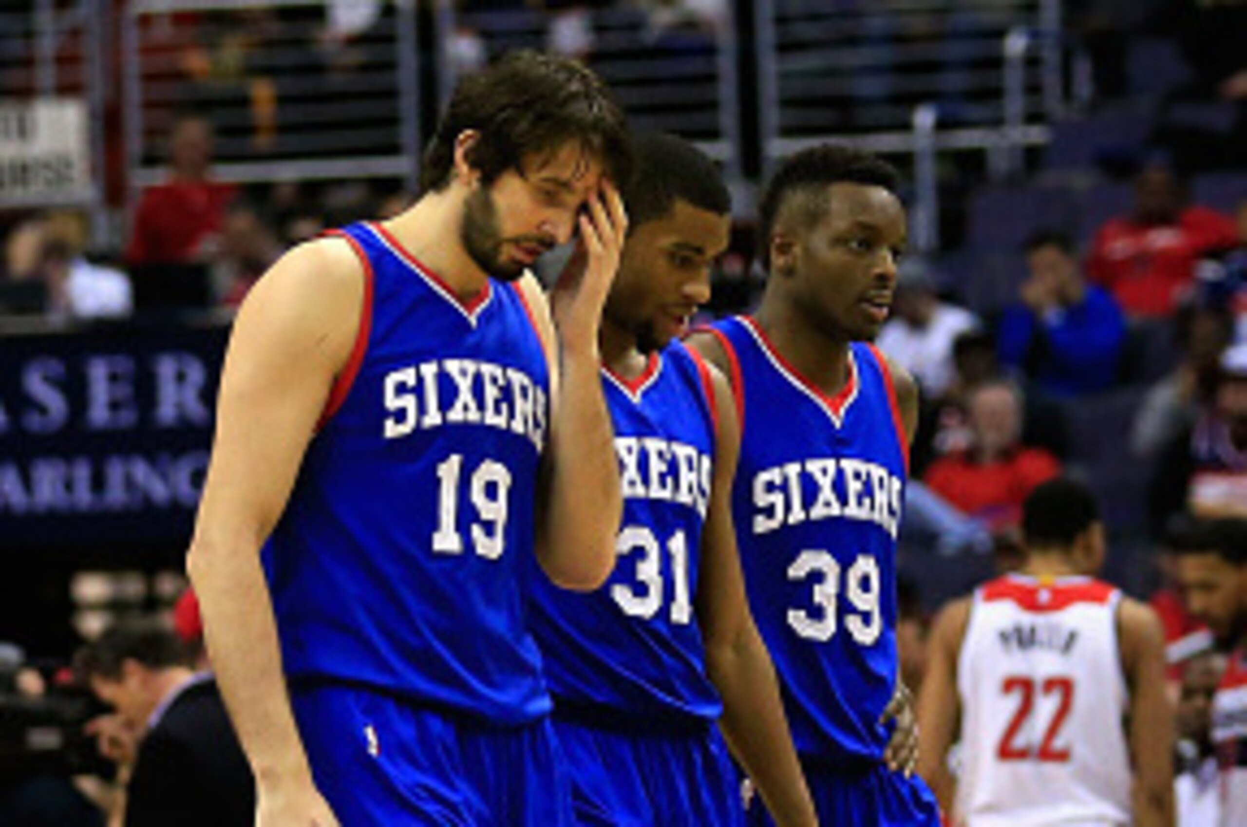 WASHINGTON, DC - JANUARY 19: Furkan Aldemir #19, Hollis Thompson #31, Jerami Grant #39 and JaKarr Sampson #9 of the Philadelphia 76ers walk off the court during a timeout against the Washington Wizards at Verizon Center on January 19, 2015 in Washington, 