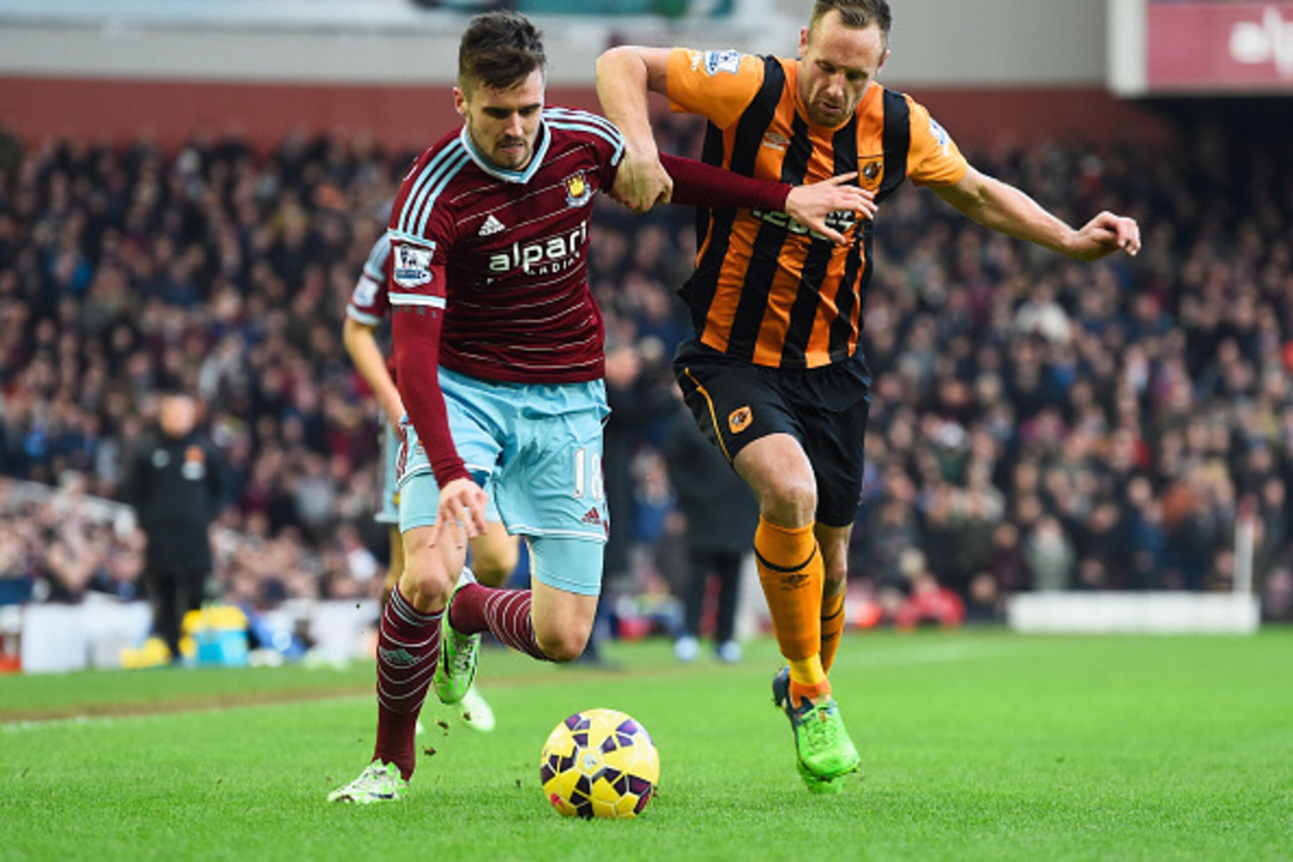 LONDON, ENGLAND - JANUARY 18:  David Meyler of Hull City grabs Carl Jenkinson of West Ham United during the Barclays Premier League match between West Ham United and Hull City at Boleyn Ground on January 18, 2015 in London, England.  (Photo by Mike Hewitt