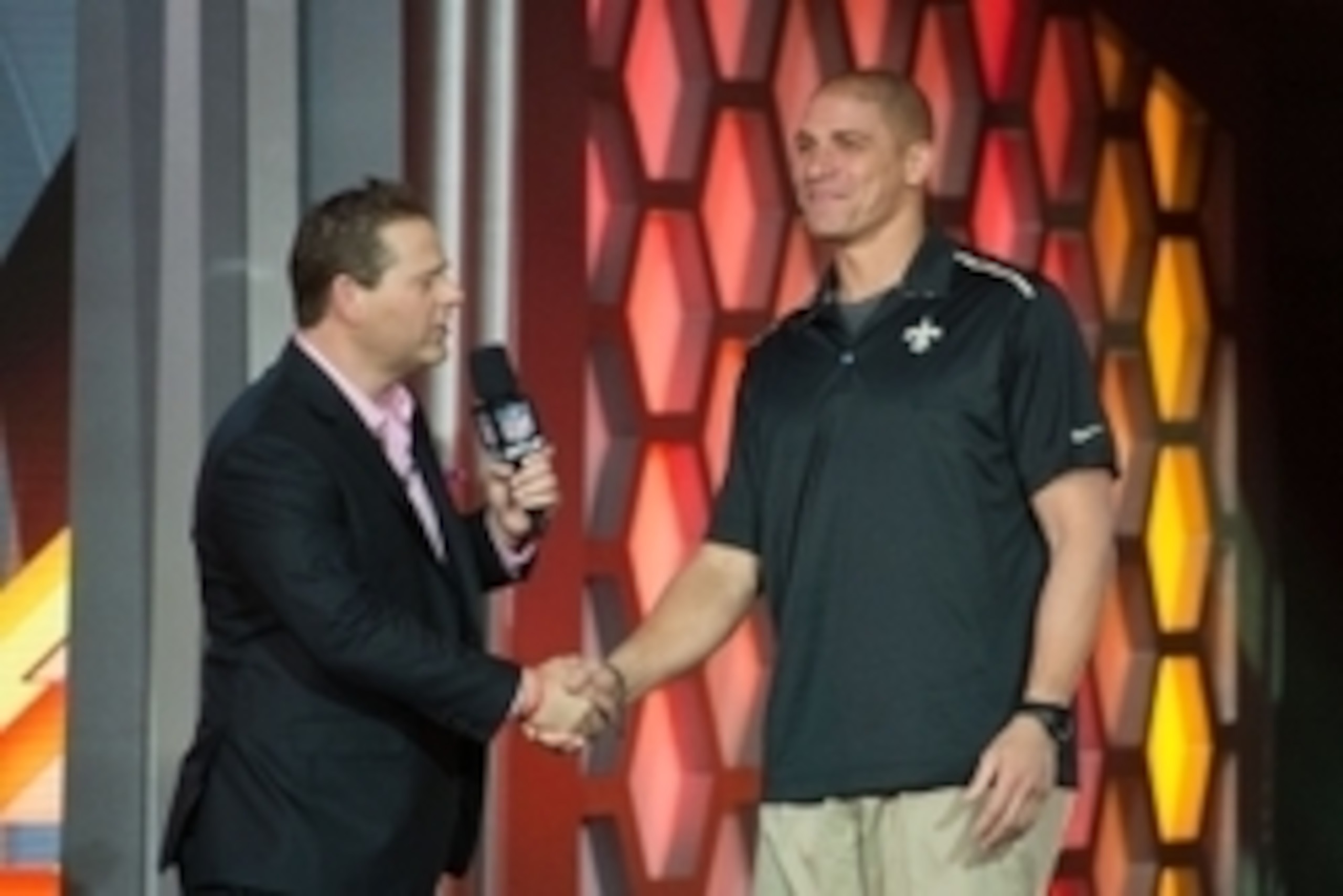 Jan 21, 2015; Phoenix, AZ, USA; New Orleans Saints tight end Jimmy Graham (80, right) shakes hands with NFL Network reporter Chris Rose (left) after being selected by Team Irvin during the Pro Bowl Draft at The Arizona Biltmore. Mandatory Credit: Kyle Ter