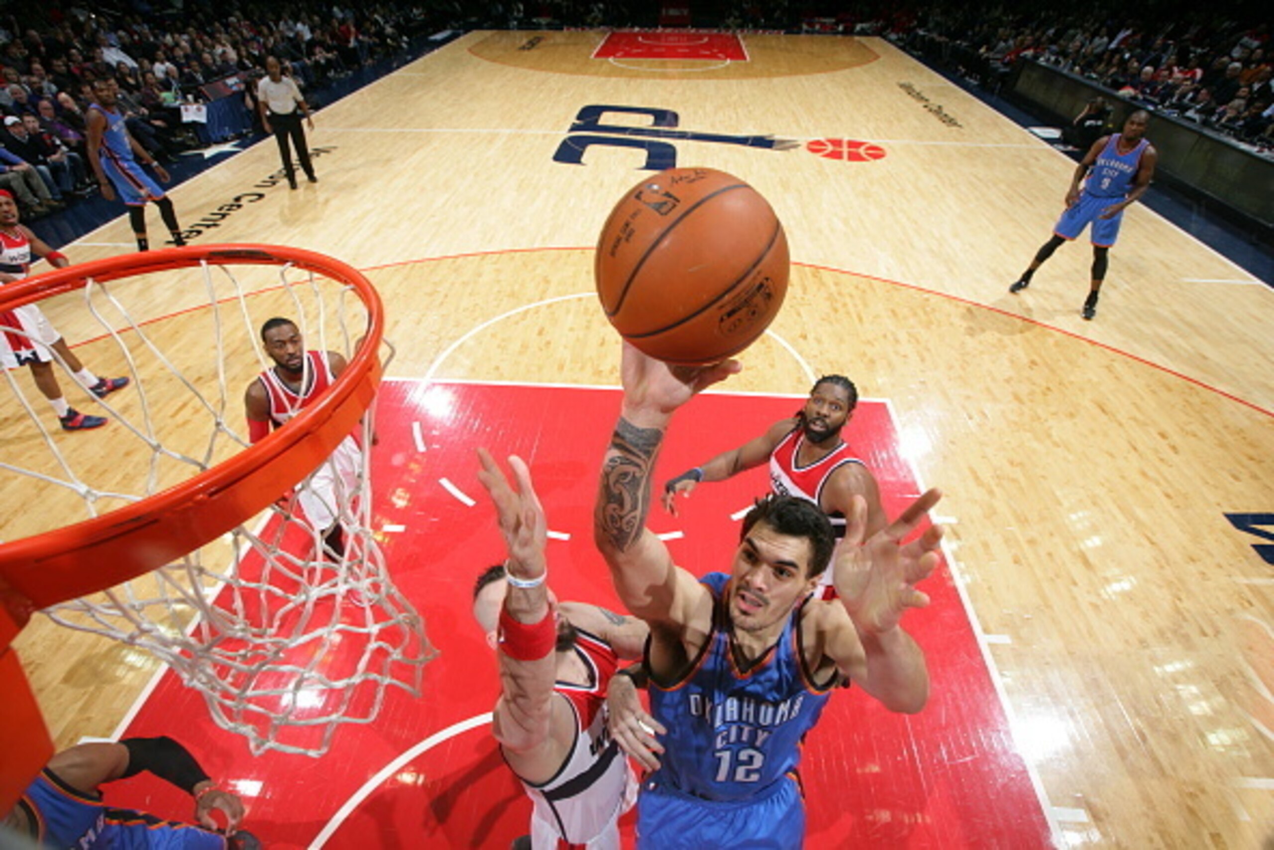 WASHINGTON, DC - JANUARY 21: Steven Adams #12 of the Oklahoma City Thunder shoots against the Washington Wizards on January 21, 2015 at Verizon Center in Washington, DC. NOTE TO USER: User expressly acknowledges and agrees that, by downloading and or usi WASHINGTON, DC - JANUARY 21: Steven Adams #12 of the Oklahoma City Thunder shoots against the Washington Wizards on January 21, 2015 at Verizon Center in Washington, DC. NOTE TO USER: User expressly acknowledges and agrees that, by downloading and or usi