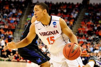 RALEIGH, NC - MARCH 23: Malcolm Brogdon #15 of the Virginia Cavaliers handles the ball in the first half against the Memphis Tigers during the third round of the 2014 NCAA Men's Basketball Tournament at PNC Arena on March 23, 2014 in Raleigh, North Caroli