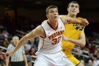 Jan 7, 2015; Los Angeles, CA, USA;  USC Trojans forward Nikola Jovanovic (32) and California Golden Bears forward David Kravish (45) battle under the basket in the second half of the game at Galen Center. USC won 71-57. Mandatory Credit: Jayne Kamin-Oncea