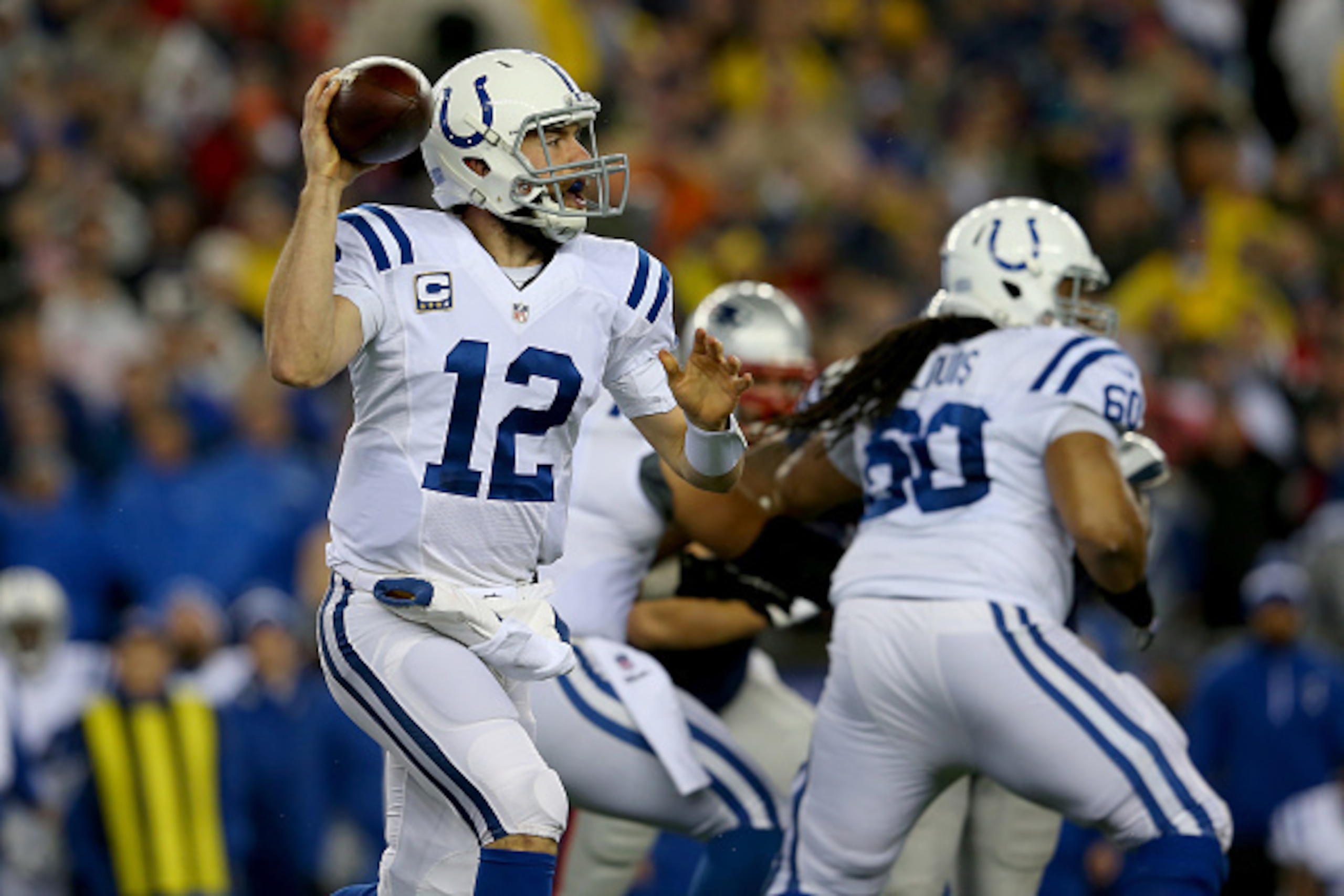 FOXBORO, MA - JANUARY 18:  Andrew Luck #12 of the Indianapolis Colts in action in the first quarter against the New England Patriots of the 2015 AFC Championship Game at Gillette Stadium on January 18, 2015 in Foxboro, Massachusetts.  (Photo by Jim Rogash